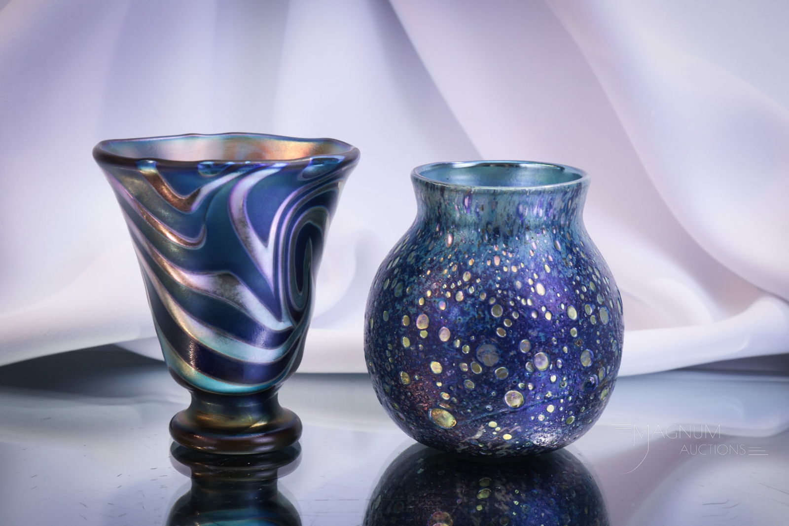 2 pc Lot Lotton Art Glass Toothpick Holders: Two fine signed Lotton art glass toothpick holders. The first is a pedestal form in King Tut decoration in blue iridescent finish. It is signed "Charles Lotton, 1989." The other is a Cypriot Iridescen