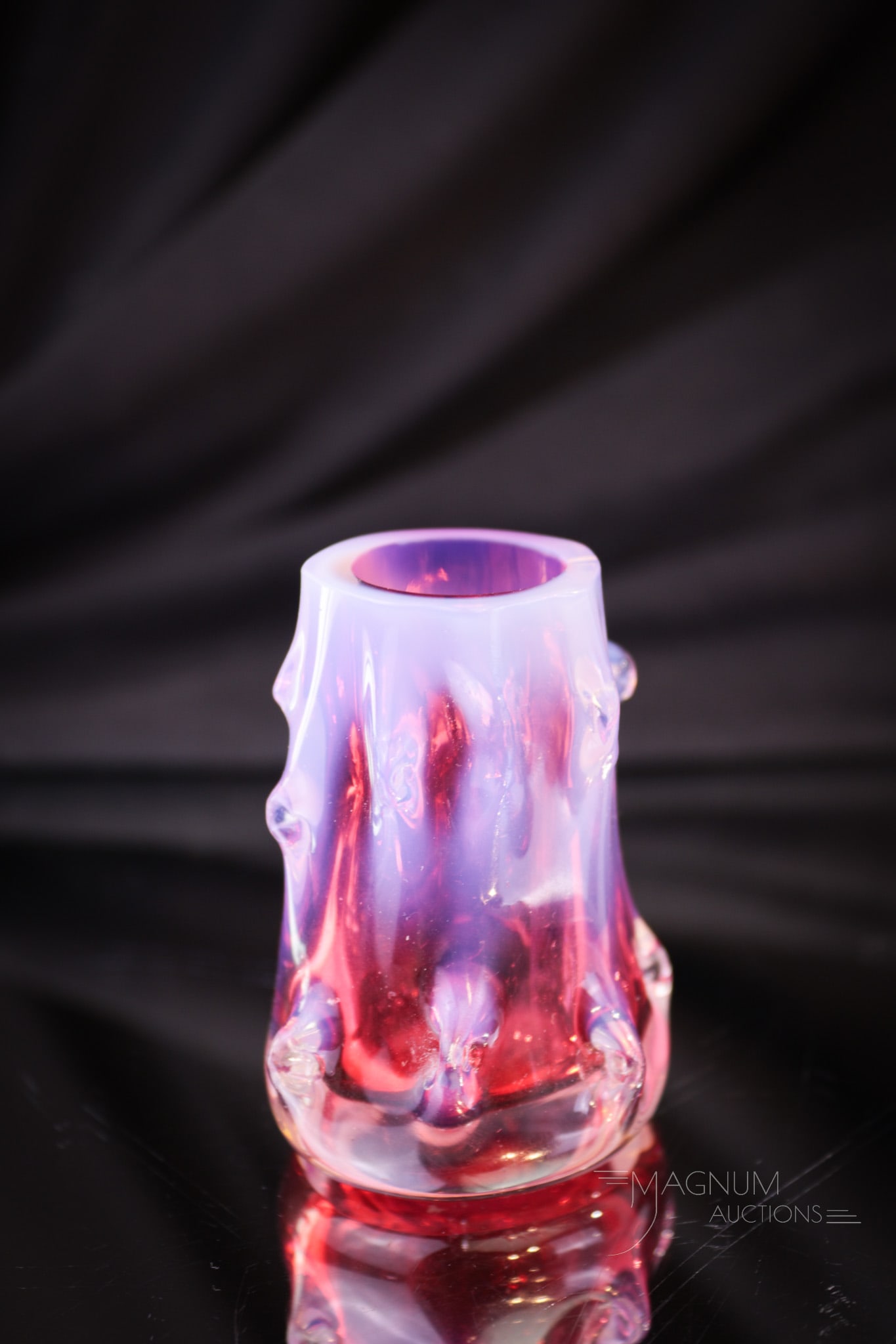Cranberry Opalescent Victorian Thorny Glass Toothpick Holder: A gem for sure for all of you Pickies! This little cranberry opalescent Victorian toothpick holder measures in at 2 1/2" tall. It has a thorny form body with opal thorns. Very unusual piece.