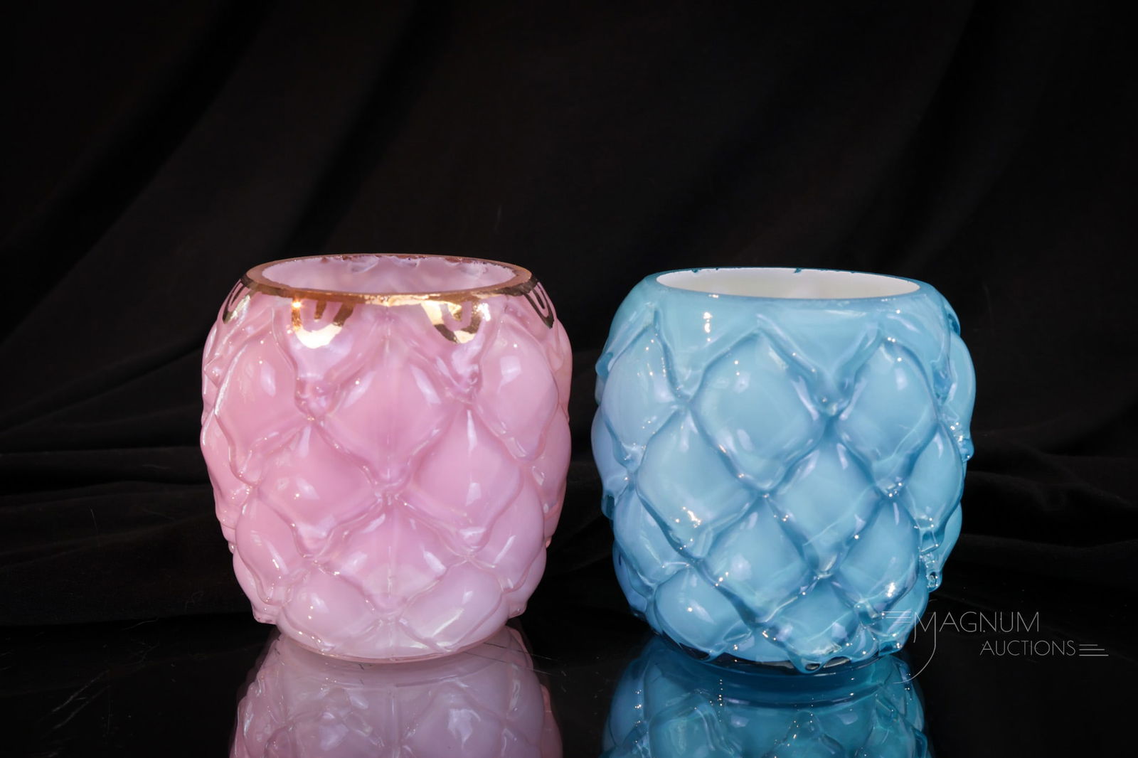 2 pc Lot Fostoria Consolidated Glass Cone Toothpick Holders: Two beauties to behold in this lot. Pink and blue cased examples. The pink with gilt trim around the rim. Minor as-made inner rim flakes are noted to each. Each measures 2 1/4" tall.