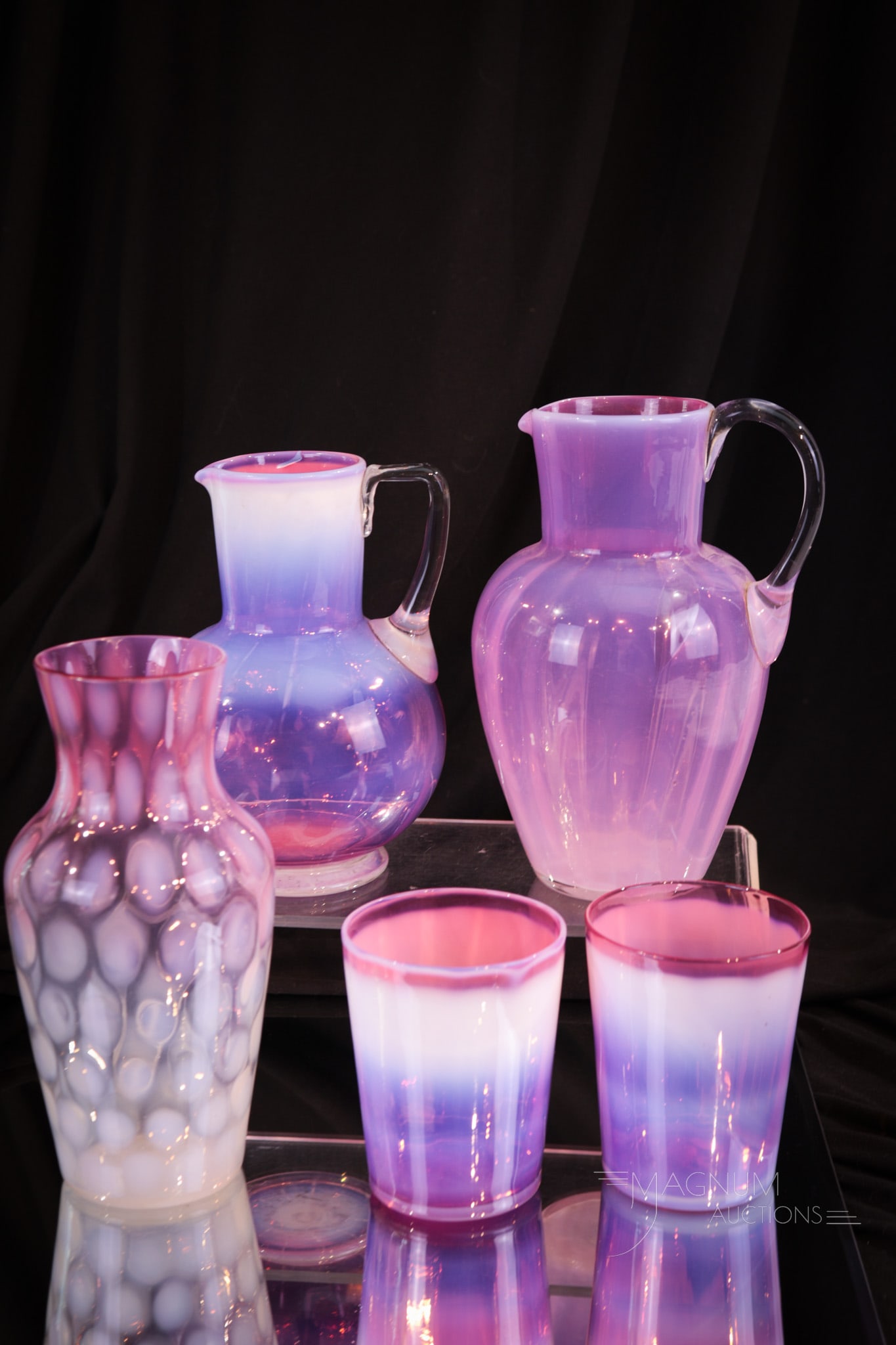 5 pc Lot Victorian Opalescent Cranberry Glass: Five selections sure to bring a smile to the collector's heart. This lot is comprised of a cranberry opal night set made up of a pitcher and two tumblers. This set along with a rubina opalescent vase