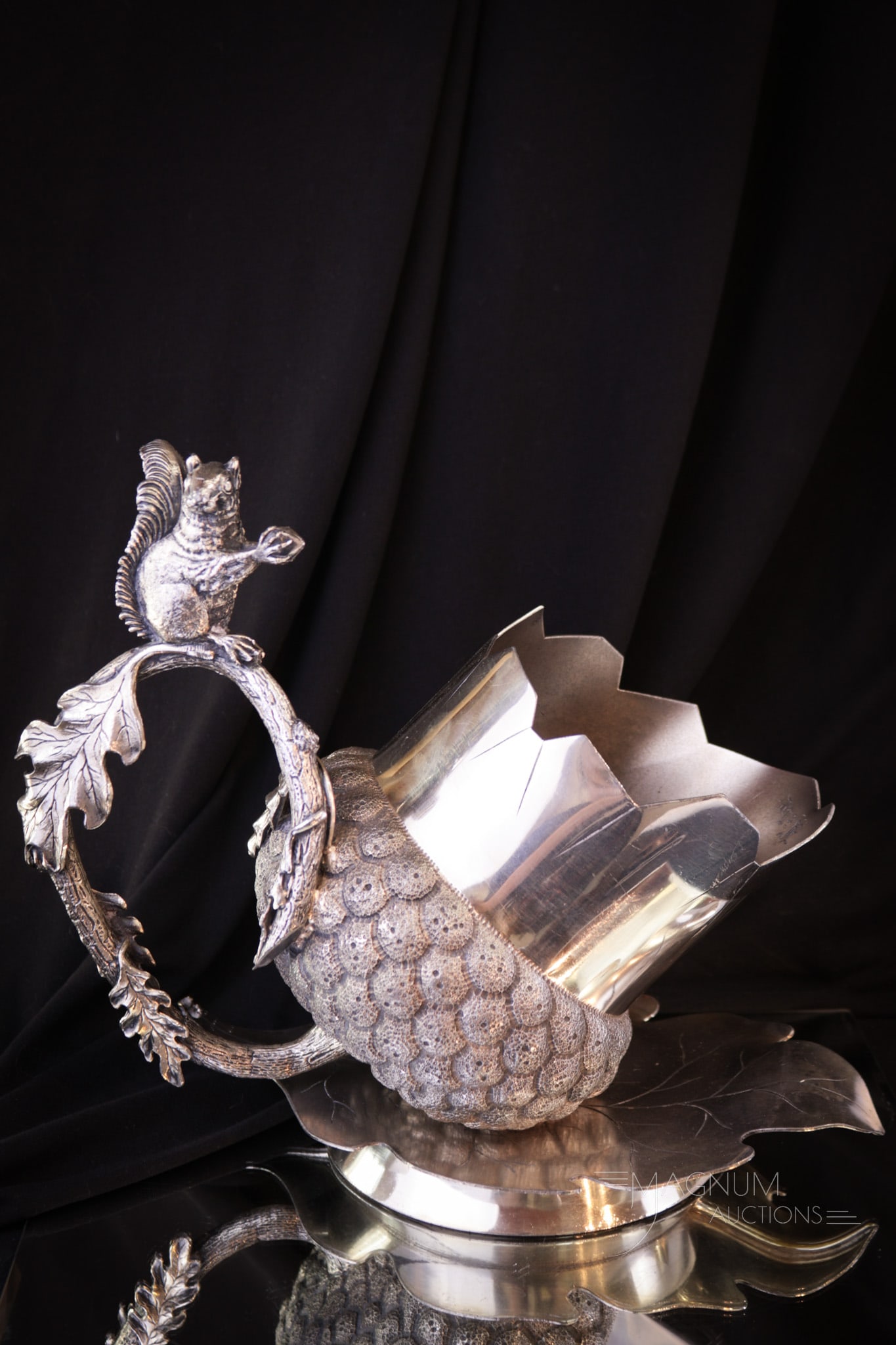 Victorian Meriden Silverplate Figural Acorn & Squirrel Nut Bowl: A quaint form here folks! This giant acorn nut bowl is signed Meriden silverplate. It features an oak leaf base and branch with a cute little squirrel perched on the top. Piece measures 9 1/2" tall.