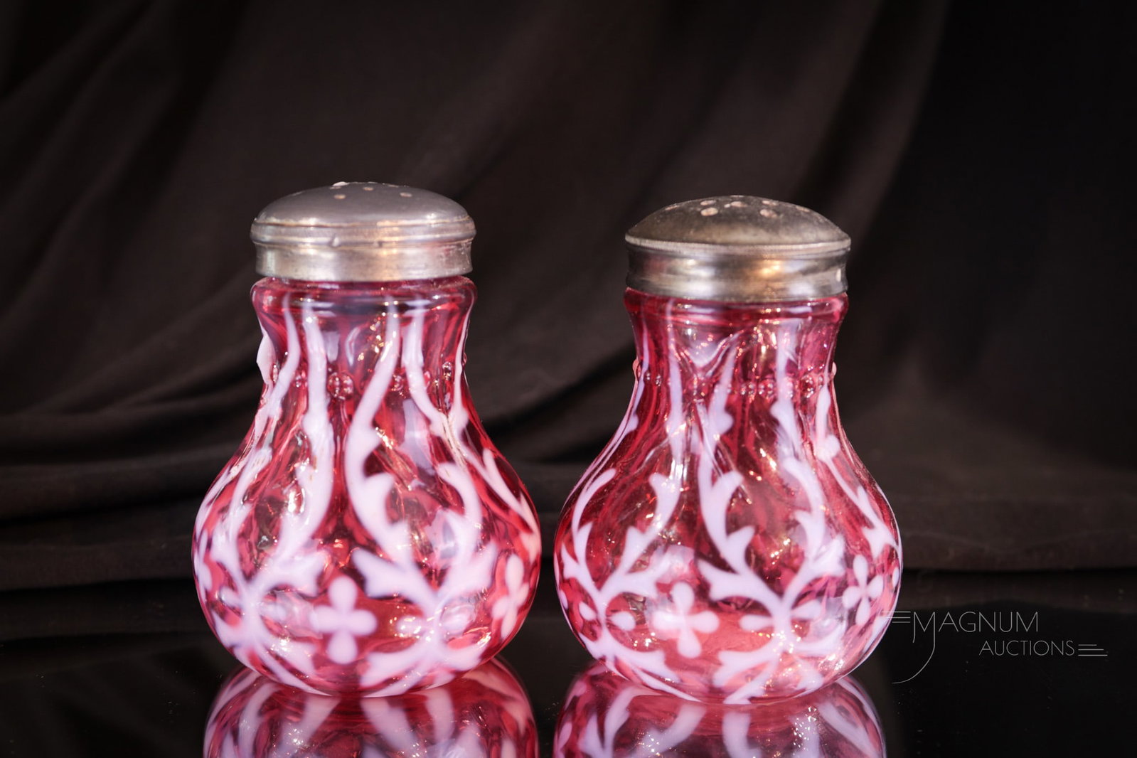Pair Northwood Cranberry Opalescent Spanish Lace Victorian Shakers: Fine well matched pair of Northwood cranberry opalescent Spanish Lace pattern shakers. A must have for any collection! Each measures 3 1/4" tall.