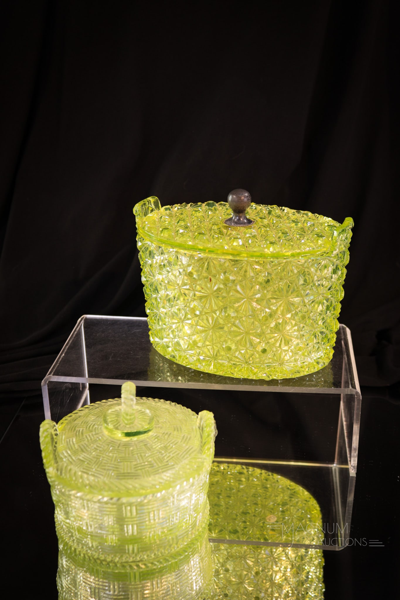 2 pc Lot Victorian Vaseline Glass: Two unique finds in Victorian vaseline glass. The first is a tab handle Daisy and Button pattern rare form butter tub with metal lid finial. The other piece in the lot is a rare Basketweave butter bin