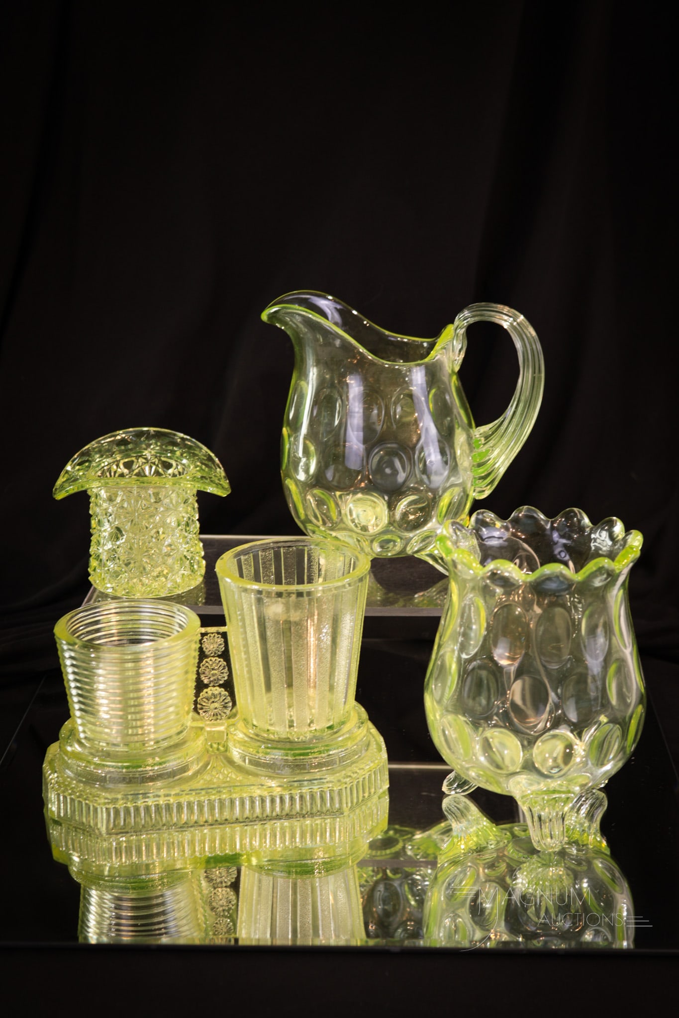 4 pc Lot Victorian Vaseline Pattern Glass Lovelies: Four desirable items in Victorian vaseline glass in this select offering. This lot includes a Duncan Coin Dot creamer and spooner, a Daisy & Button hat, and finally a rare pattern glass smoking set. T