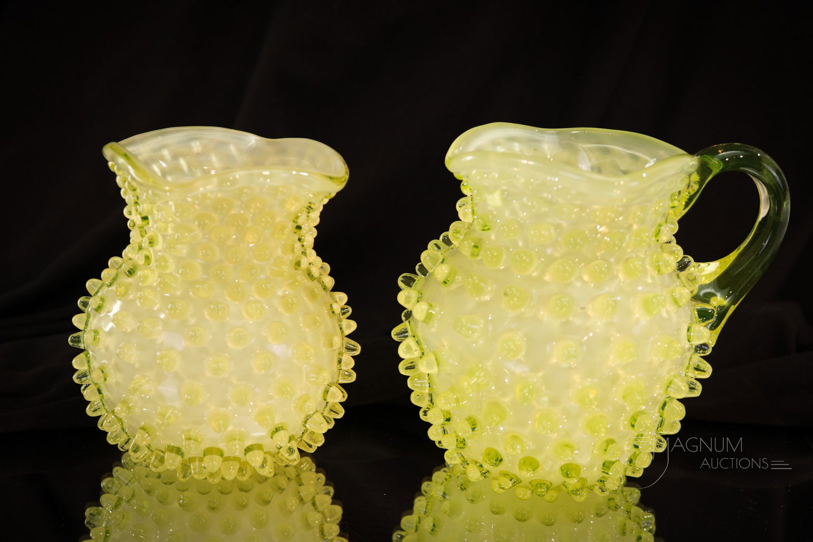2 pc Lot Victorian Hobb's Vaseline Cased Hobnail: Two fun finds in Victorian Hobb's cased alabaster vaseline hobnail. Featured in this lot is a creamer and a spooner. Each a true beauty to behold. Tallest measures 4 1/4".