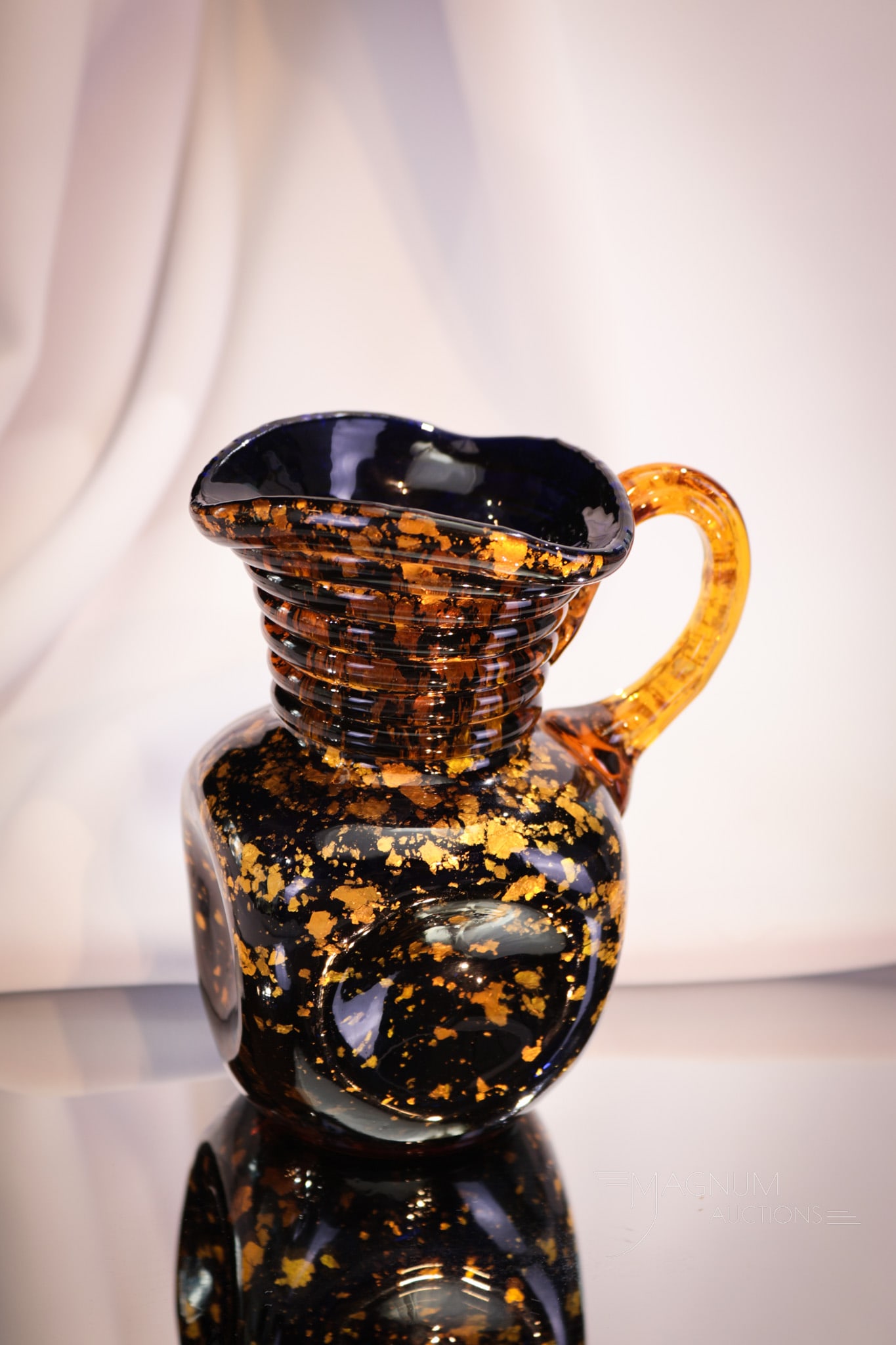Hobb's Cobalt Spangleware Victorian Glass Cream Pitcher: Seldom found Victorian glass cobalt with applied amber handle spangle glass creamer. This one with great mica inclusions. Piece measures 5 1/4" tall.
