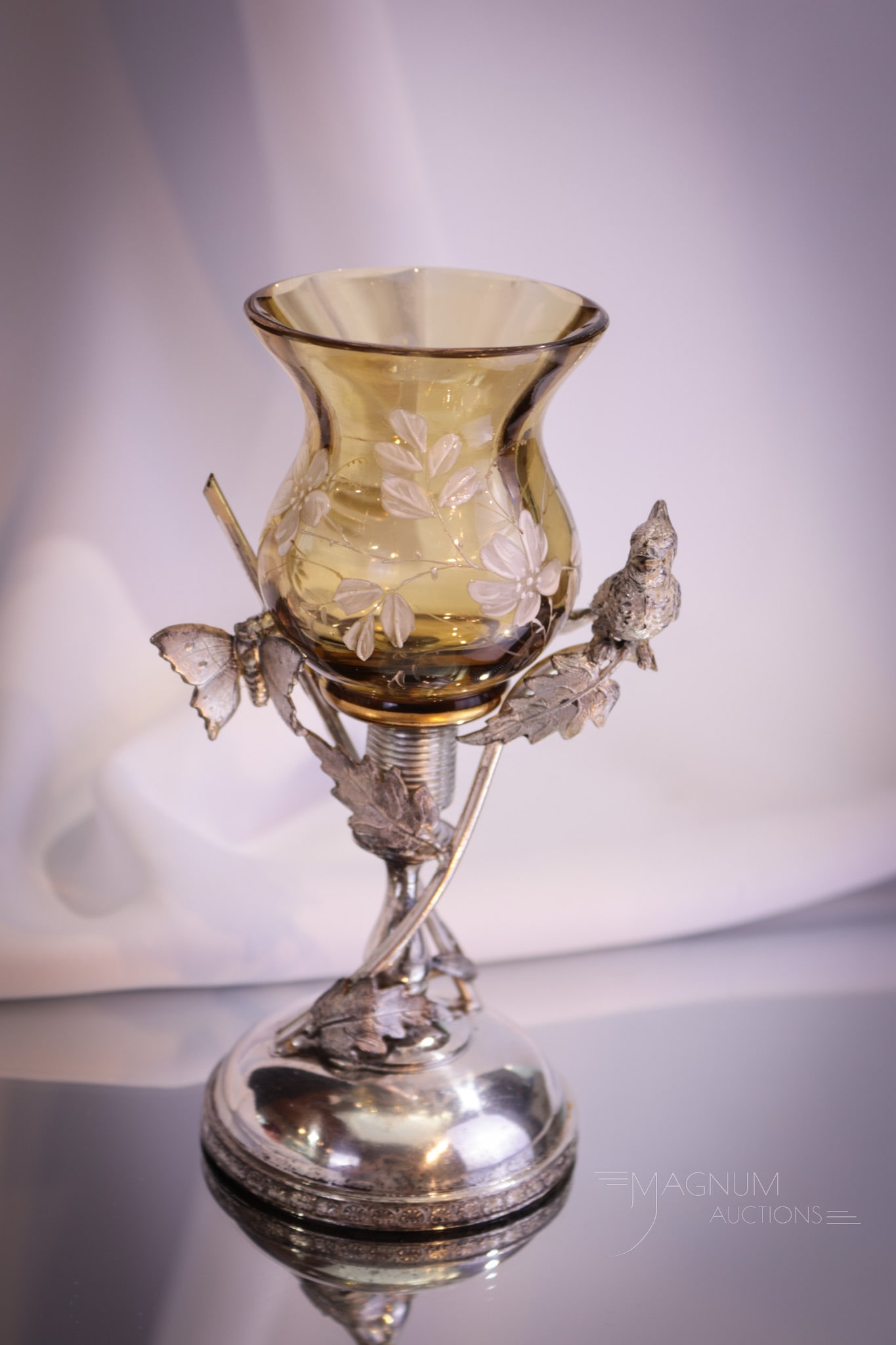 Simpson Hall Miller Victorian Silverplate Figural Glass Bud Vase: Charming Victorian silverplate and glass signed Simpson, Hall, and Miller figural bud vase. This piece has a figural bird and butterfly in the metal work and is complimented by an amber enameled glass