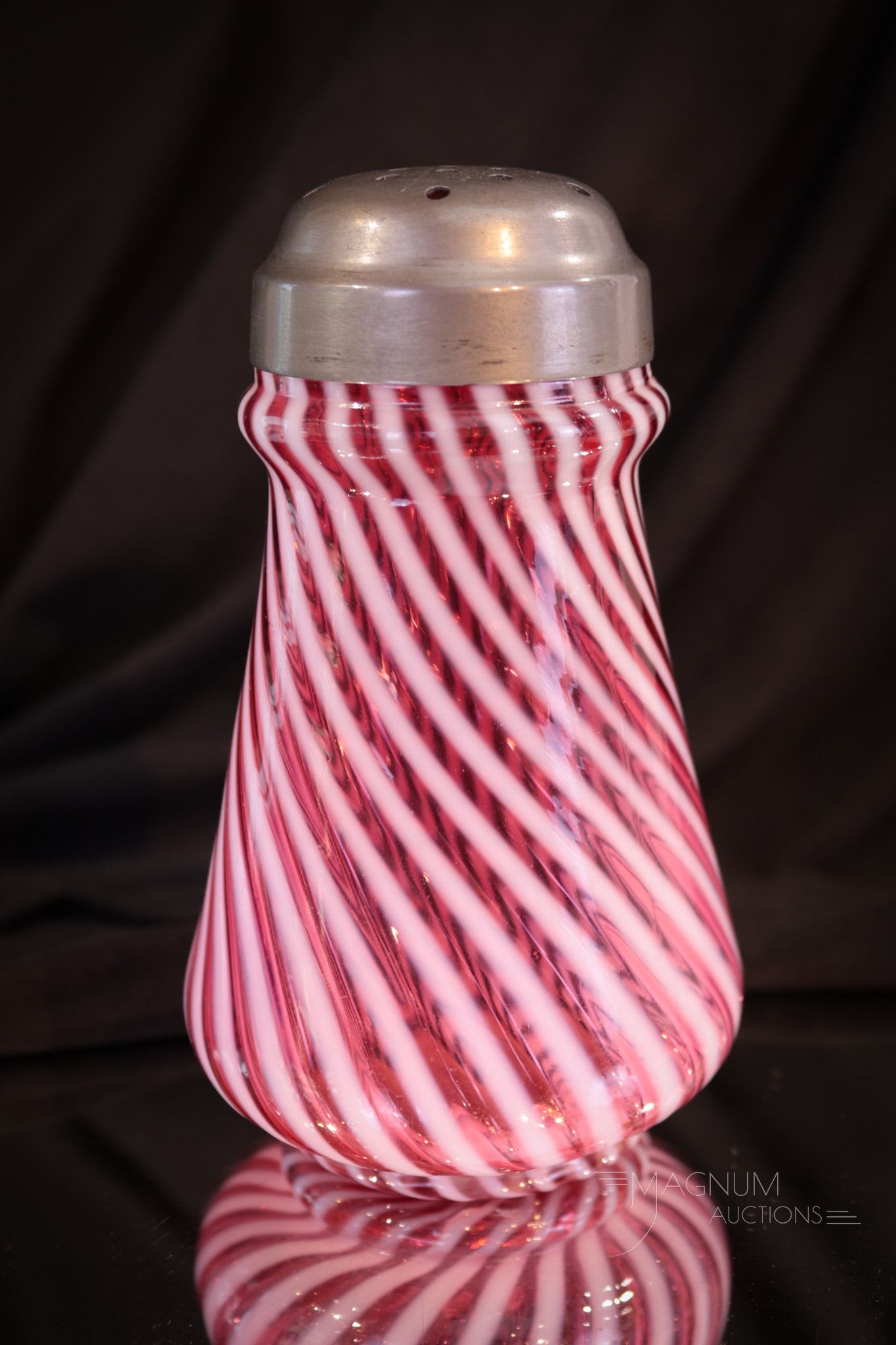 Hobb's Cranberry Opalescent Victorian Glass Sugar Shaker: Perfect example of a beautiful Victorian sugar shaker in cranberry opalescent glass. This one by Hobb's and in the swirl pattern. Shaker measures 5 1/2" tall.