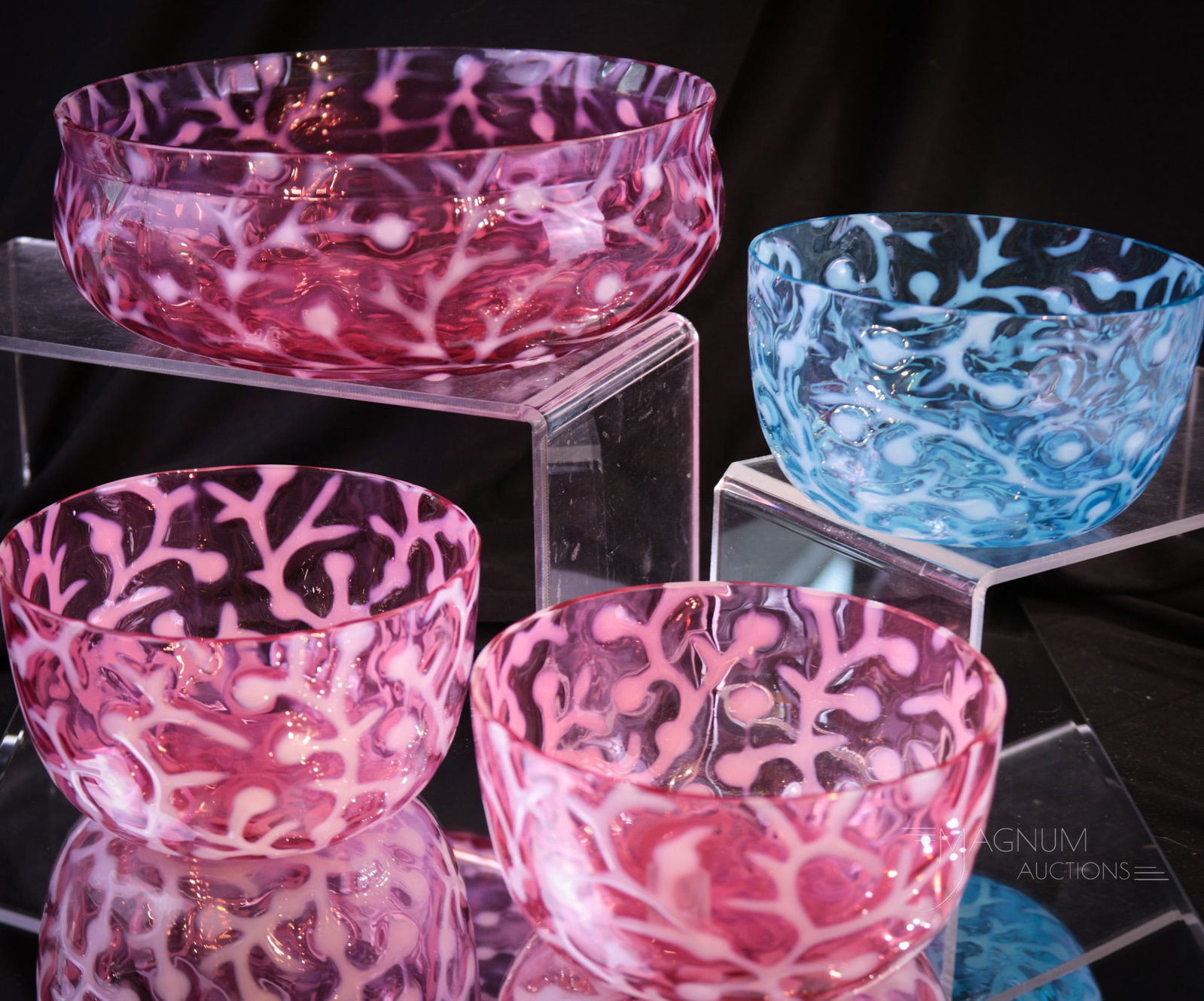 4 pc Lot Hobb's Victorian Glass Seaweed Opalescent Bowls: Four finds in Hobb's opalescent Seaweed pattern. This lot is comprised by a large berry bowl and three finger bowls. Two of the finger bowls in cranberry and one in blue. Largest measures 2 1/2" tall,