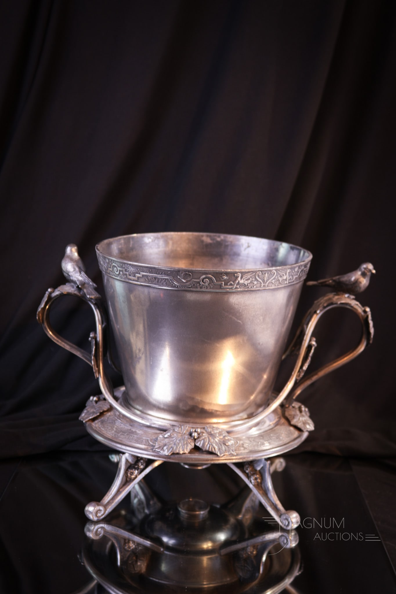 Reed & Barton Victorian Silverplate Flower Pot: Scarce find is this signed Reed & Barton Victorian silverplate flower pot in ornate figural holder. Pot is lacking metal base insert but resides in original holder. Piece measures 8" tall, 11" wide.