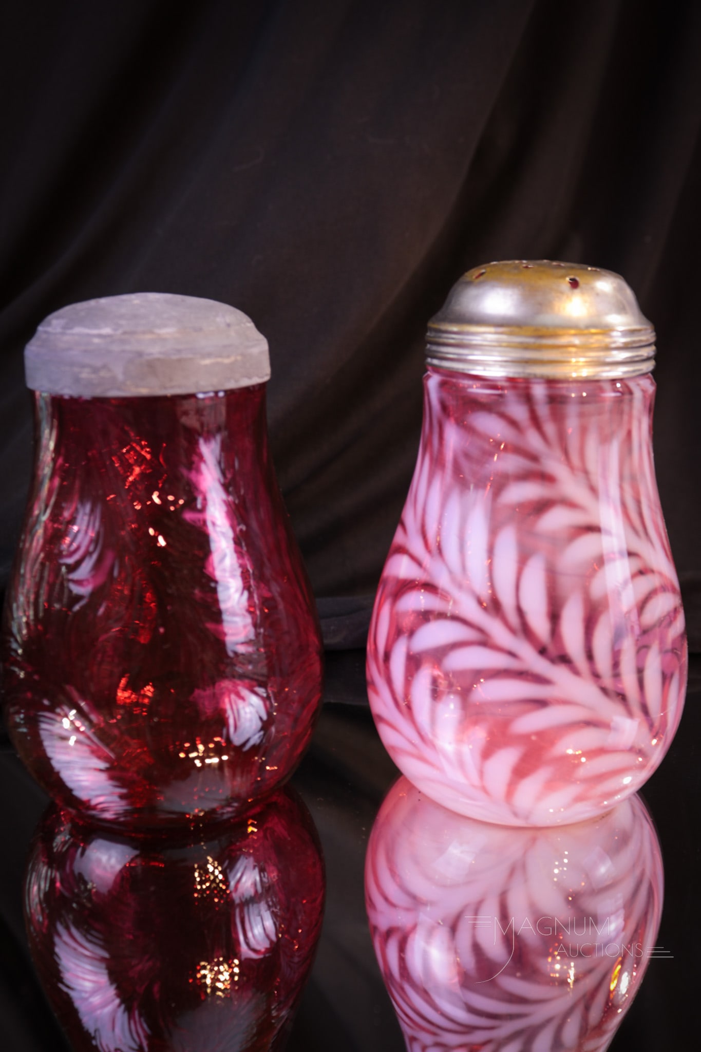 2 pc Lot Cranberry Opalescent & More Victorian Glass Fern Sugar Shakers: Two fine examples of Victorian cranberry Fern sugar shakers. One in cranberry opalescent glass and one in solid cranberry. Make sure you add them to your Christmas wish list! Tallest measures 5".