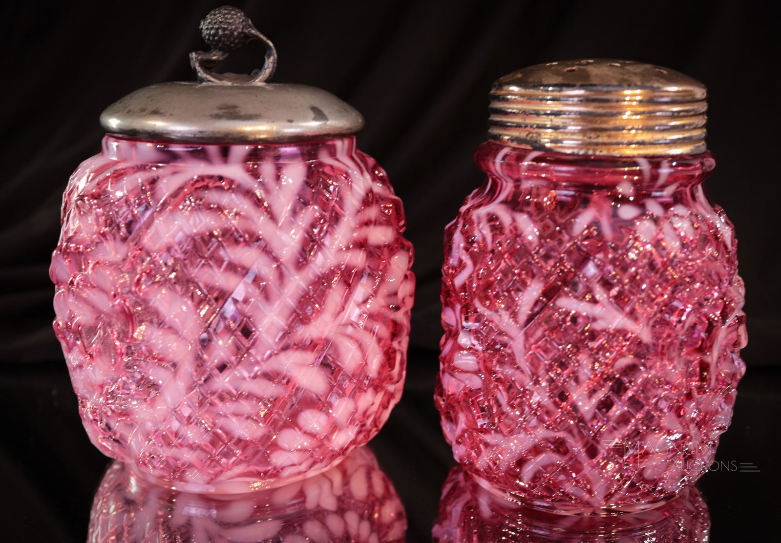 Northwood Cranberry Opalescent Victorian Sugar Shaker & Pickle Castor Jar: Two lovelies in cranberry opalescent Northwood Victorian glass. The first is a sugar shaker in the Apple Blossom mold. The second piece is the matching pickle castor jar complete with silverplate lid.