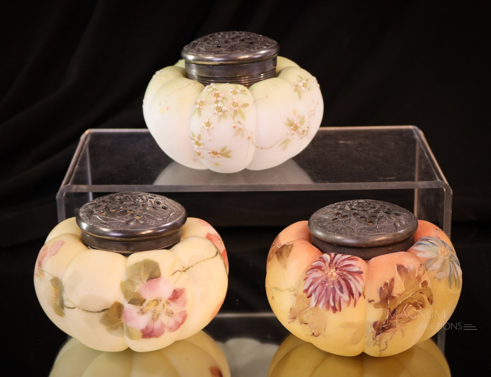 3 pc Lot Mt. Washington Victorian Enameled Glass Sugar Shakers: Three superlative examples of the fine wares Mt. Washington made in the Victorian era. Each of these sugar shakers measures 2 1/2" tall. Each with a different floral motif.