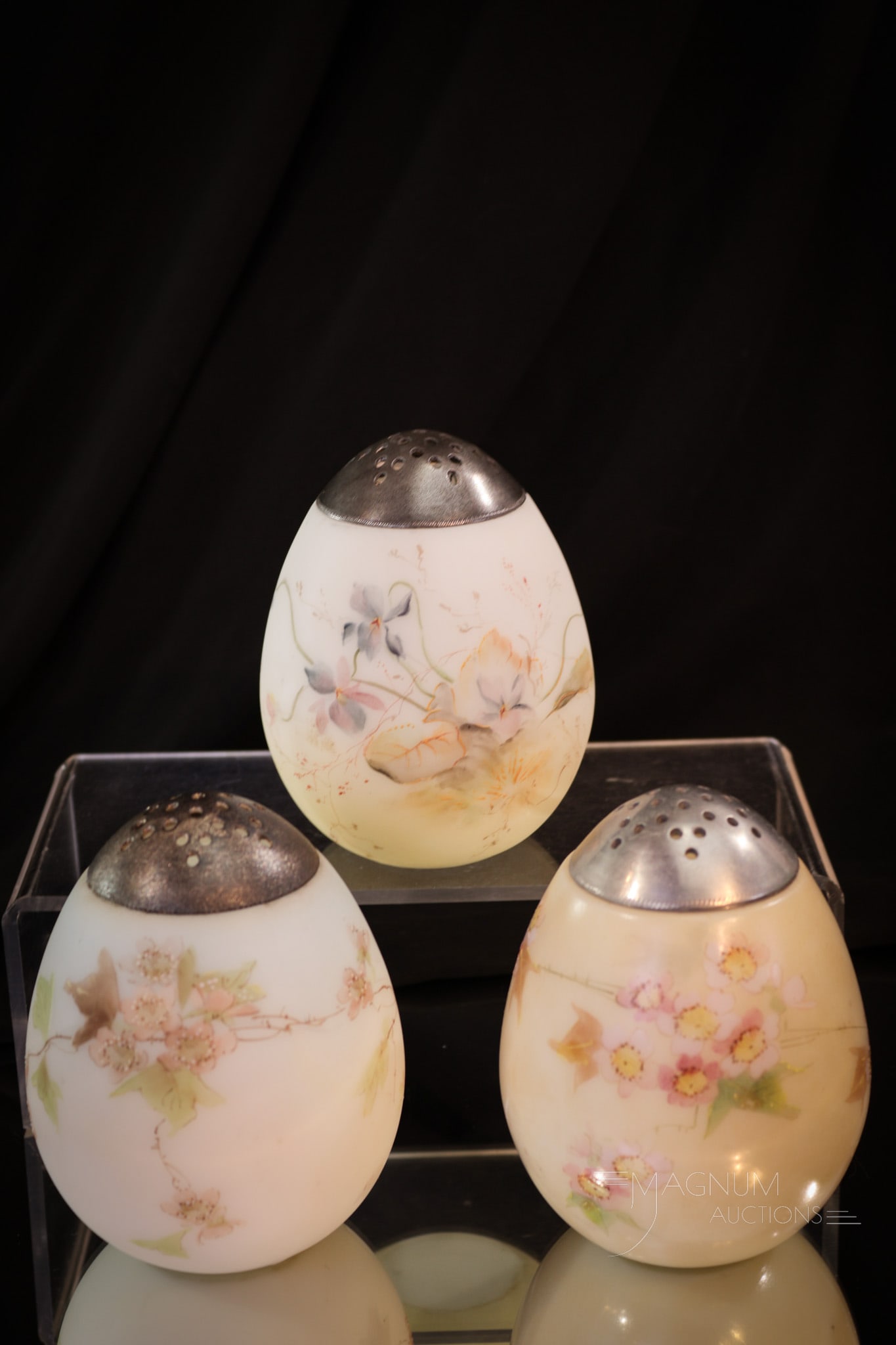 3 pc Lot Mt. Washington Victorian Glass Egg Sugar Shakers: Three superlative Mt. Washington glass egg sugar shakers. Each with nice color and perfect floral decoration. Each measures 4" tall.