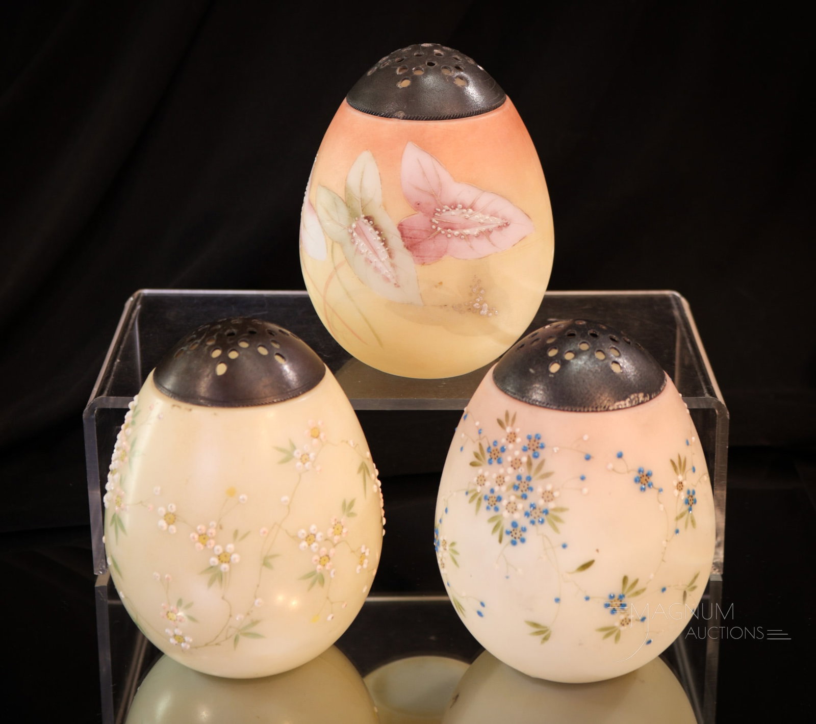 3 pc Lot Mt. Washington Egg Victorian Glass Sugar Shakers: Three fine sugar shakers sure to grace your collection. Each of these measures 4" tall. Each expertly hand-painted with a bounty of florals. What a nice lot!