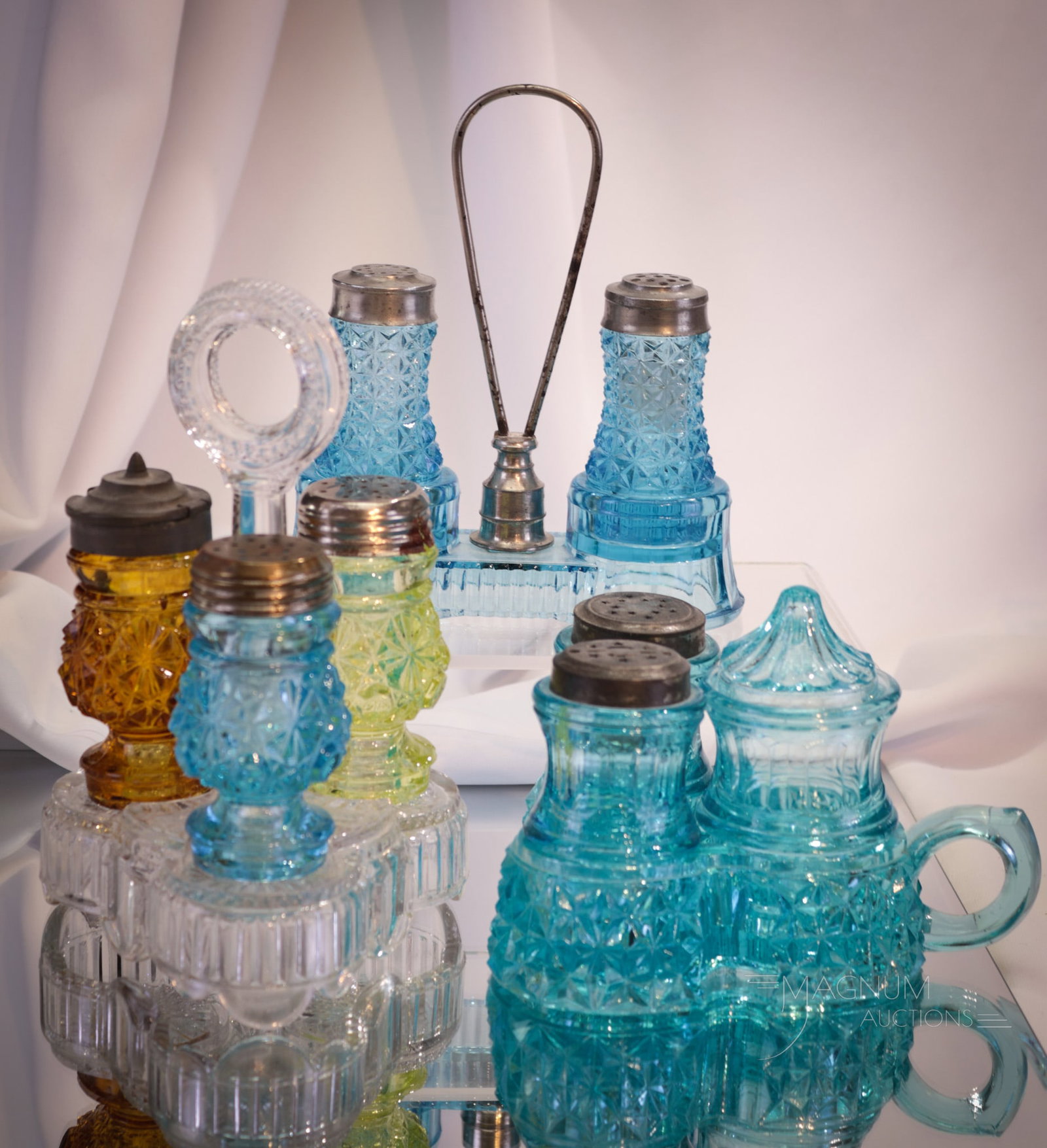 3 pc Lot EAPG Pattern Glass Victorian Condiment Sets: Three unique Victorian pattern glass condiment sets in various colors. Each a delight. Lot is comprised by a Finecut pattern variant in blue, a Daisy & Button in vaseline and a pair of blue shakers in