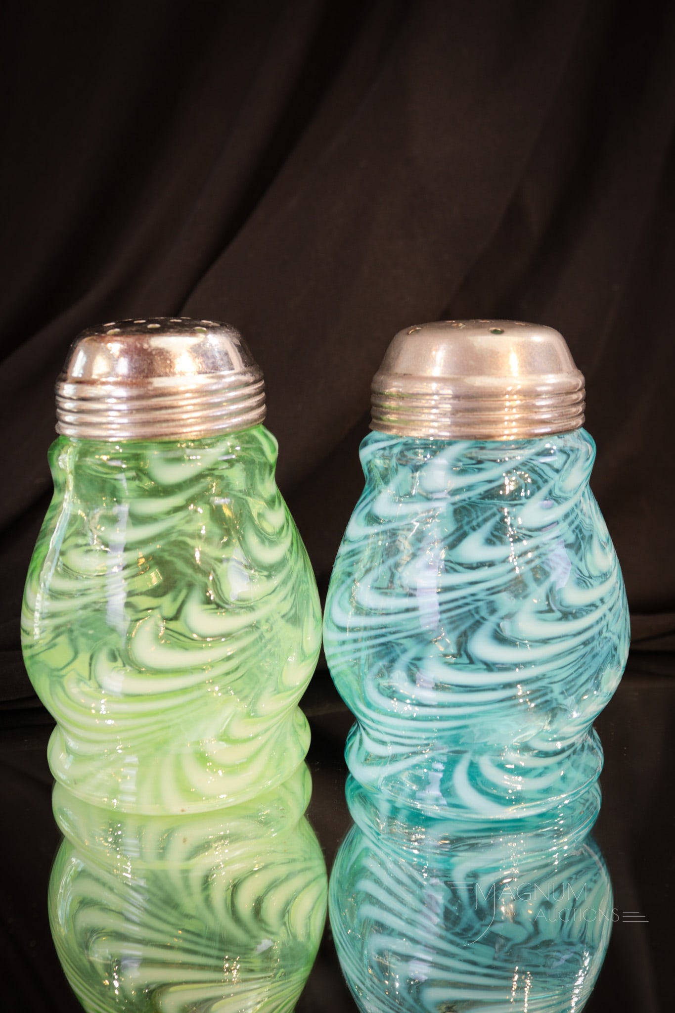 2 pc Lot Victorian Blown Twist Opalescent Sugar Shakers: Two excellent examples of the opal pattern Blown Twist. One in blue and one in green opal. Both are in the Wide-Waist mold. Each measures 4 3/4" tall.
