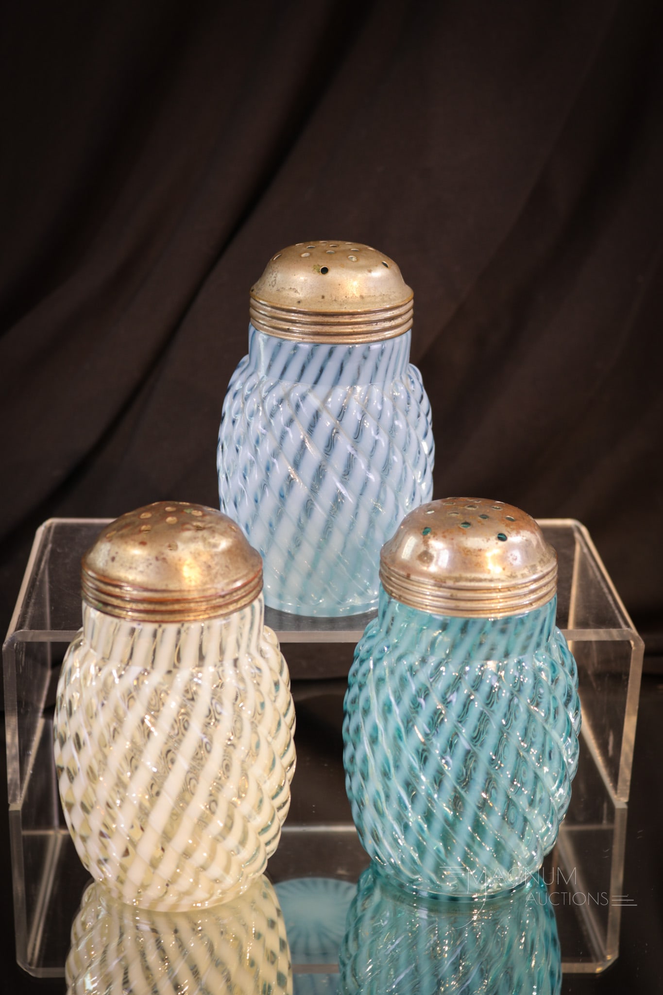 3 pc Lot Victorian Reverse Swirl Opalescent Glass Sugar Shakers: Three unique examples of the Reverse Swirl pattern. Two different variations of blue and one crystal opal. Each shaker measures 4 1/2" tall.