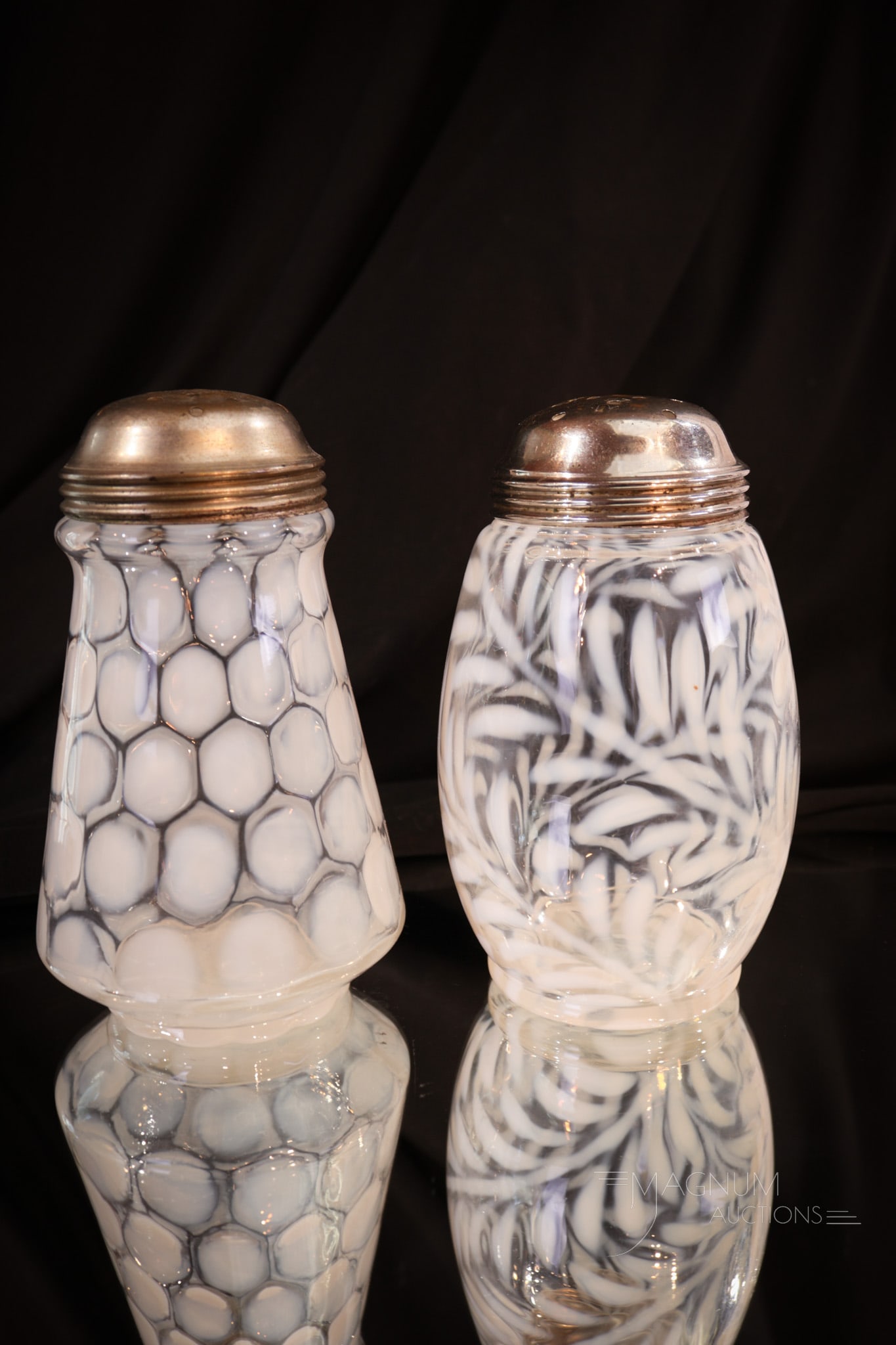 2 pc Lot Victorian Opalescent Sugar Shakers: Two examples of crystal opalescent Victorian glass sugar shakers. One in a tapered form with an opalescent coinspot pattern. The other is in a barrel form with an opal Fern pattern. Tallest measures 5