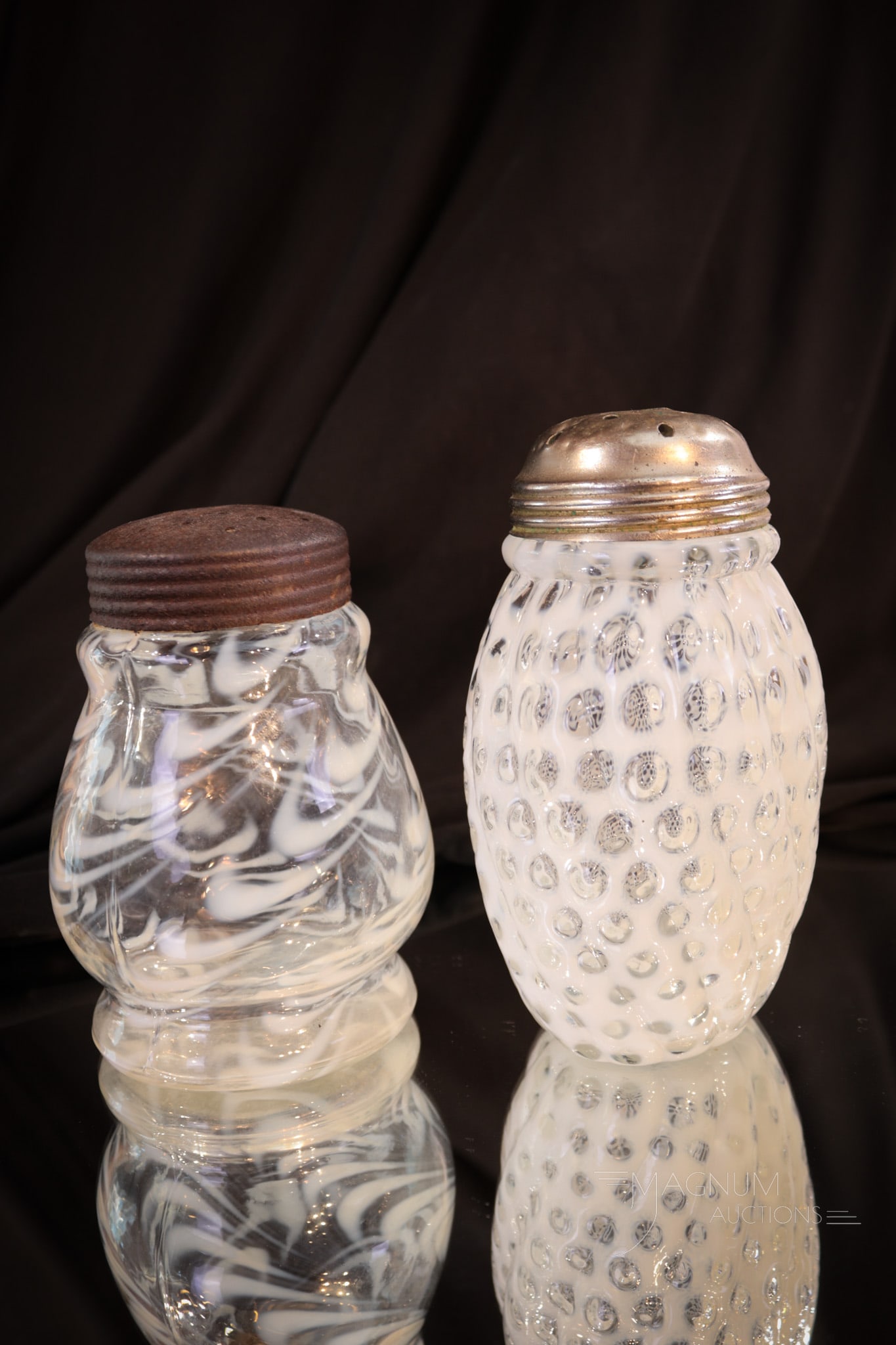 2 pc Lot Victorian Opalescent Glass Sugar Shakers: Two finds in the realm of Victorian opalescent sugar shakers. One in crystal opal in the Windows Swirled pattern. The other in the same crystal opal but in the Blown Twist pattern. Tallest measures 5"