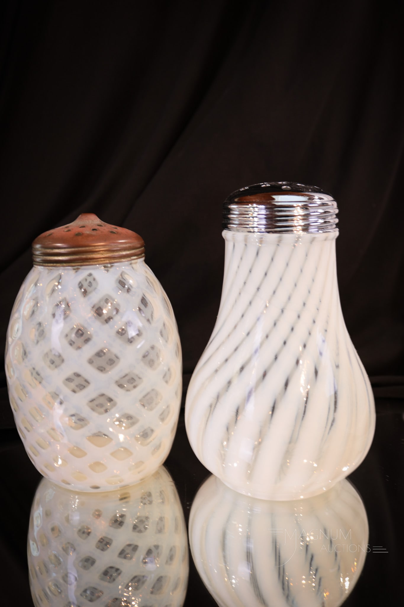 2 pc Lot Victorian & More Opalescent Glass Sugar Shakers: Two finds in the highly collectible realm of Victorian and more sugar shakers. Both of these are in crystal opalescent. One in the Bubble Lattice pattern. The other in a swirl pattern. Tallest measure