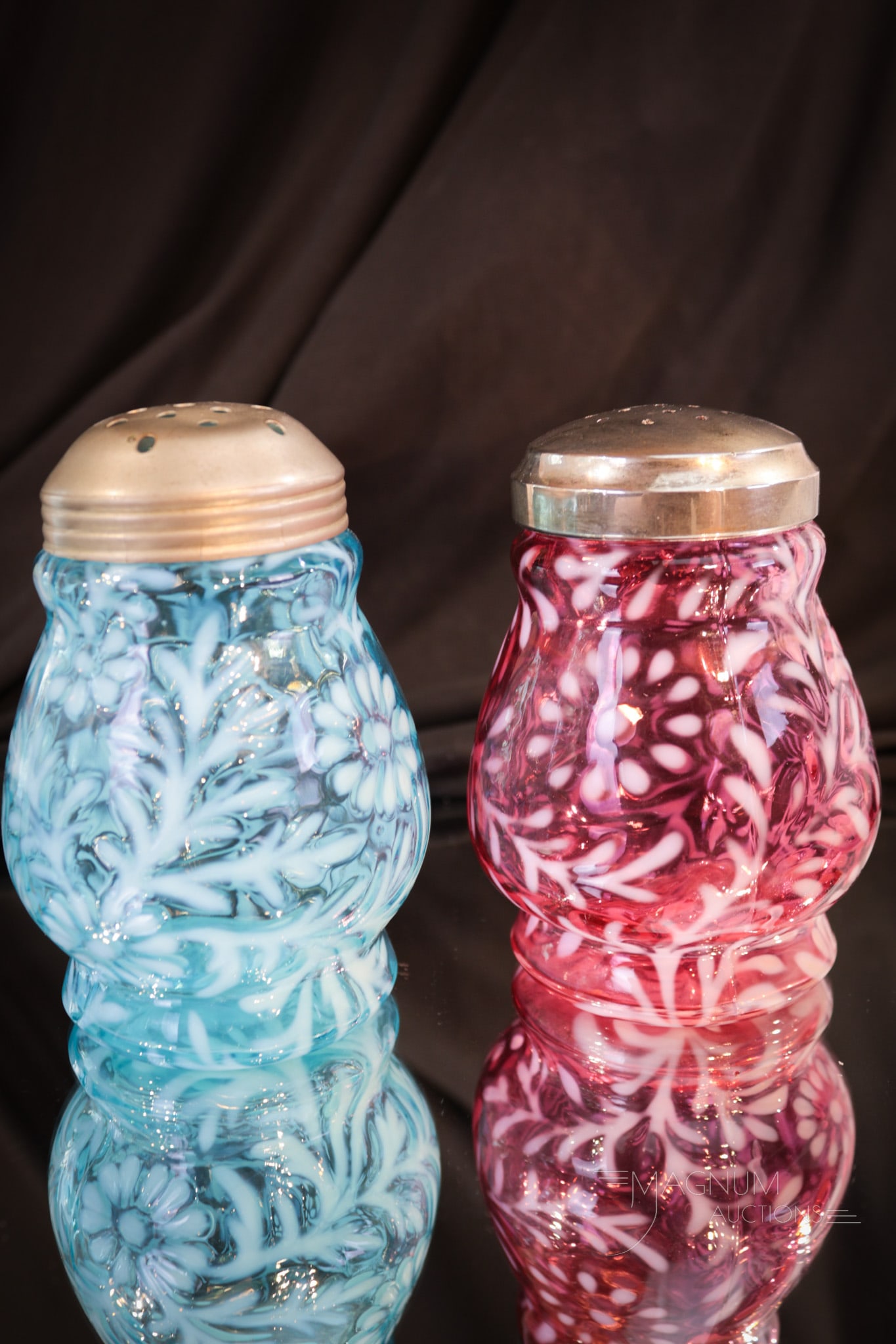 2 pc Lot Victorian Cranberry & Blue Opalescent Glass Sugar Shakers: Two nice sugar shakers in the same mold and the same pattern but different colors. Here we are offering a cranberry and a blue example of the Northwood Wide-Waist mold Daisy and Fern pattern sugar sha