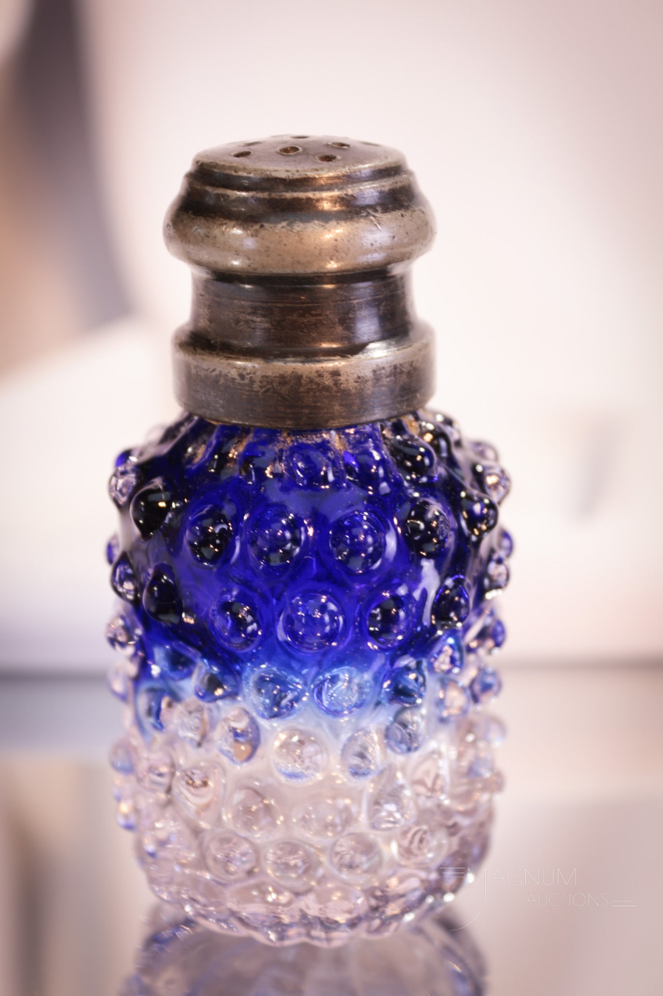 Rare Bluerina Victorian Cinched Waist Hobnail Salt Shaker: Stan up and applaud for this fine bluerina colored salt shaker. What a piece! This hobnail pattern salt shaker is a true rarity. Beautiful blue to crystal ombre' coloring. Base has a lobed daisy patte