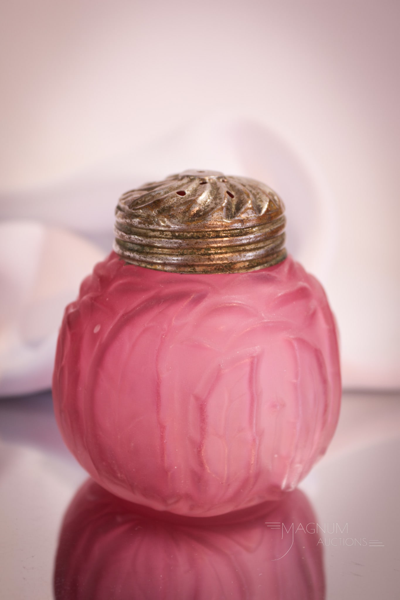 Northwood Cranberry Leaf Mold Victorian Glass Salt Shaker: Deep rich cranberry coloring makes up this fancy of a Northwood salt shaker of the Victorian era. This shaker in the Leaf Mold pattern is a gorgeous example. Can you find space for it? Shaker measures