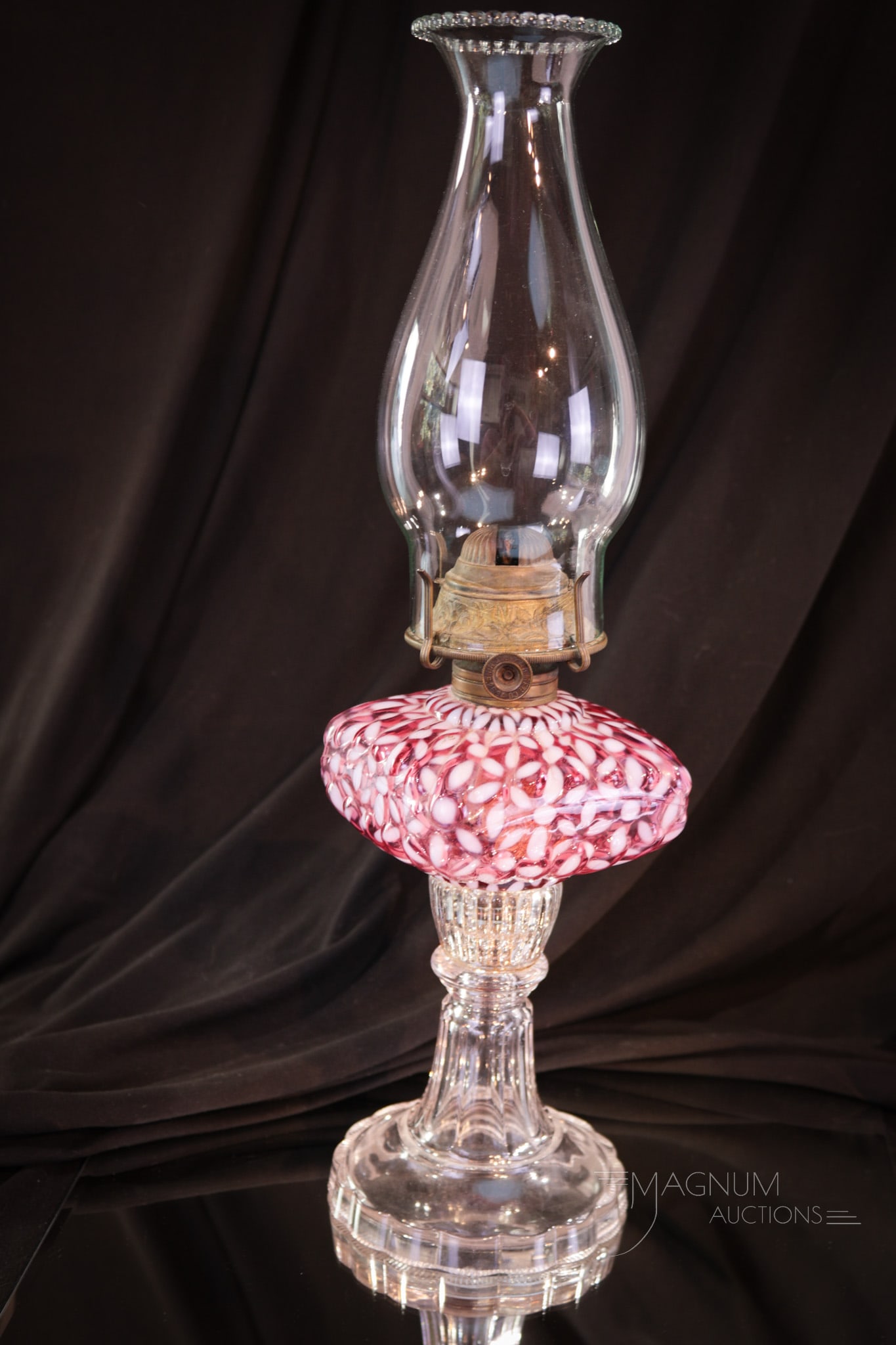 Cranberry Opalescent Snowflake Victorian Oil Lamp: What a nice example of the Snowflake opalescent pattern this lamp is. Perfect cranberry coloring and brilliant white opalescence. This lamp is complete with chimney. Lamp measures 7 1/4" tall to burne