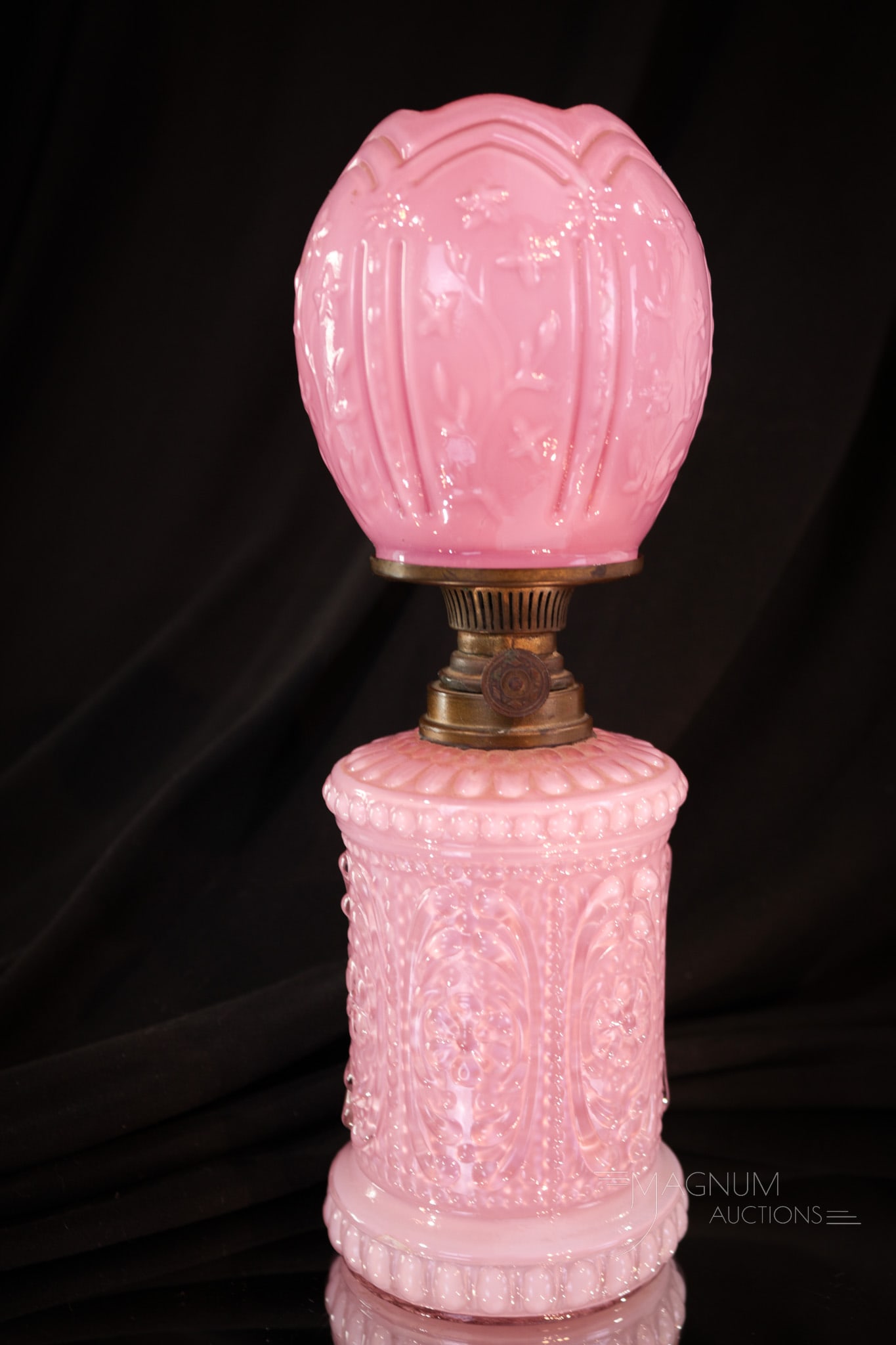 Pink Cased Victorian Miniature Oil Lamp: Fine European Victorian miniature oil lamp in cased pink glass. This little guy is complete with original burner. Lamp measures 8 1/2" tall.