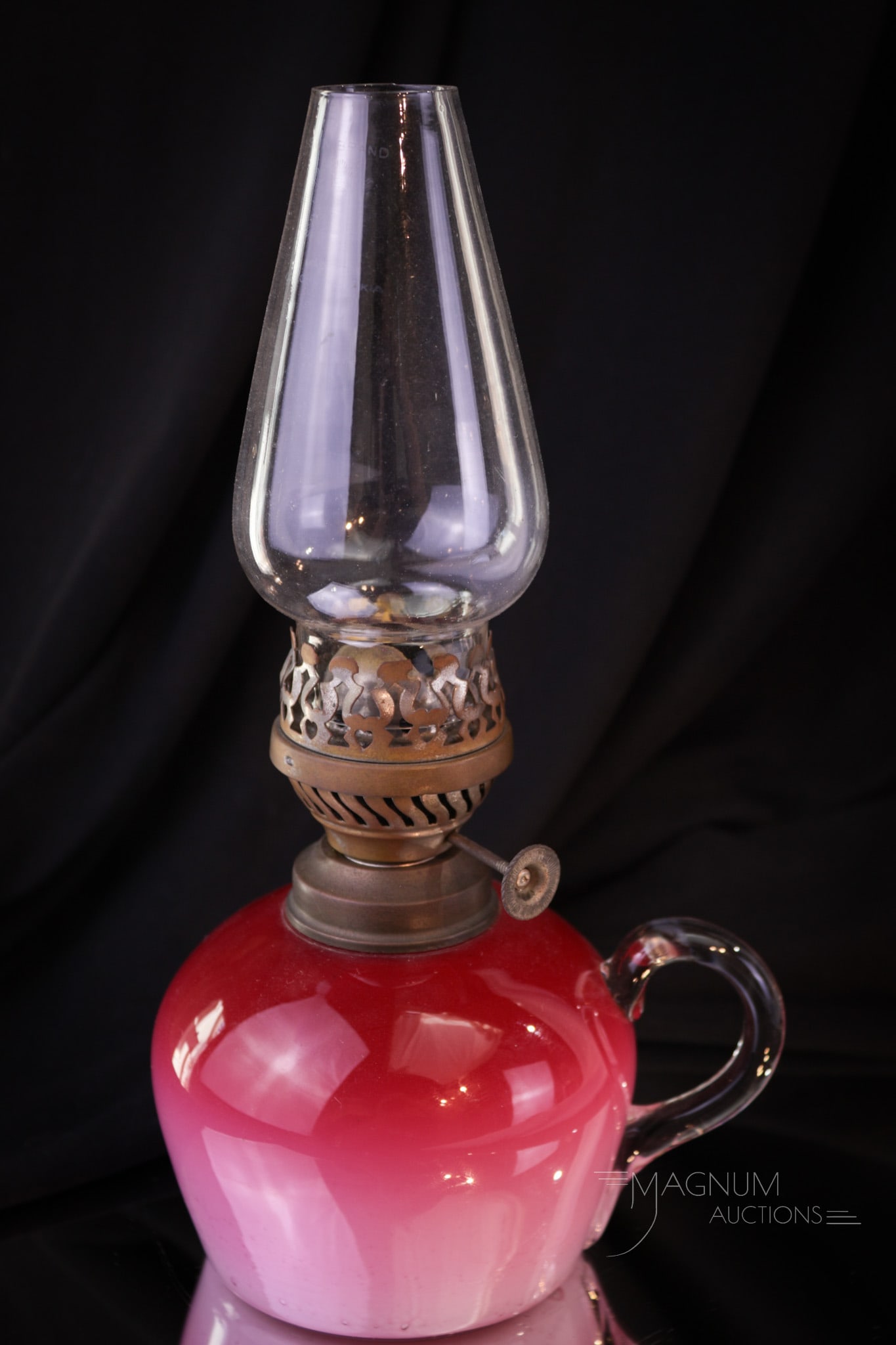 Scarce Victorian Peachblow Glass Finger Lamp: A seldom seen cased peachblow glass Victorian finger lamp. This one with clear applied handle and old burner and chimney. Complete this measures 3 1/4" tall to the top of the collar.