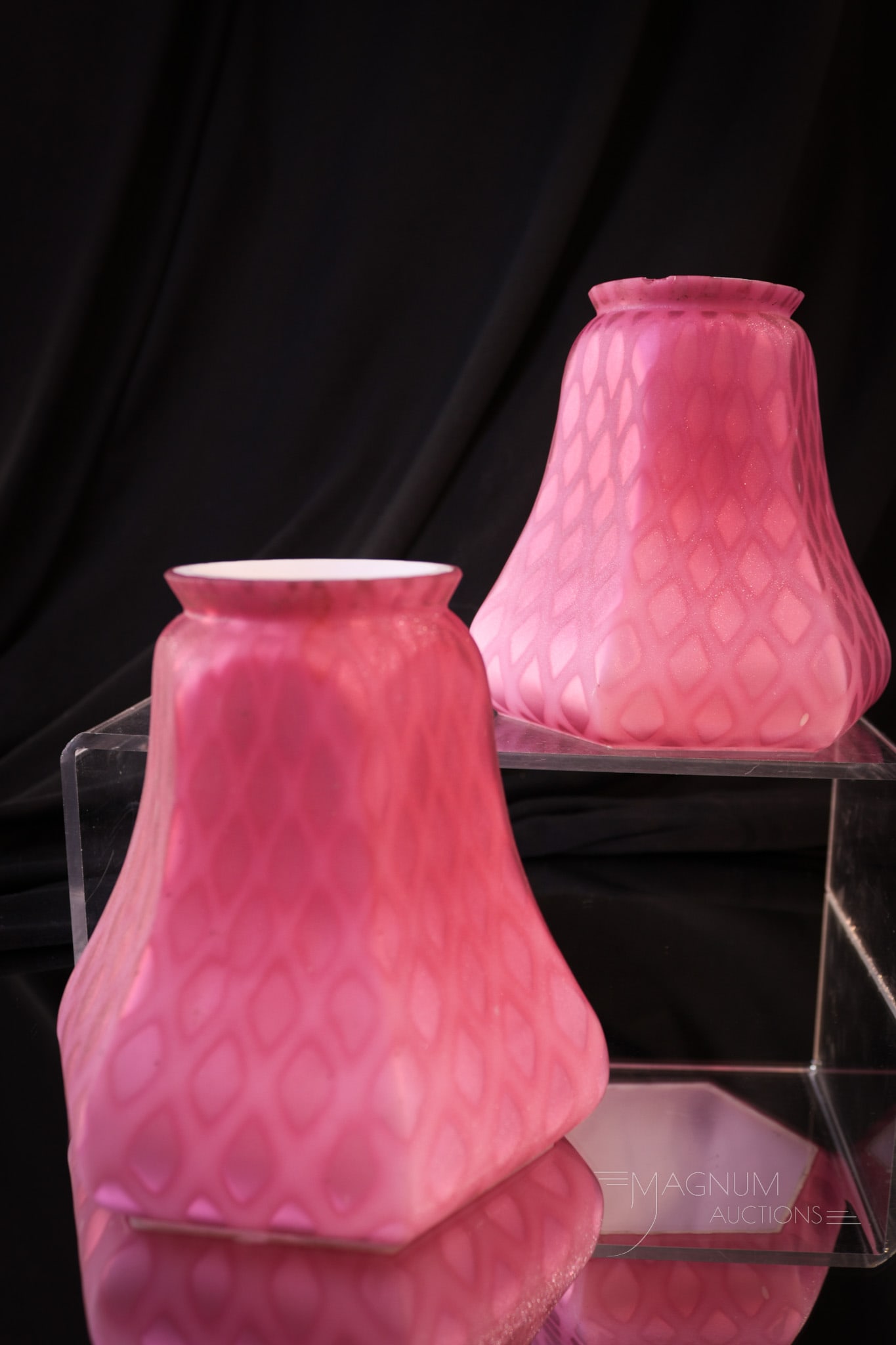 Pair Pink Satin Mother of Pearl Satin Glass Diamond Quilt Shades: Two fine pink satin mother of pearl satin glass diamond quilt shades. Each shade measures 4 1/4" tall, 4" wide, and a fitter diameter of 2 1/8". Each shade with typical fitter rim chips. One shade exh