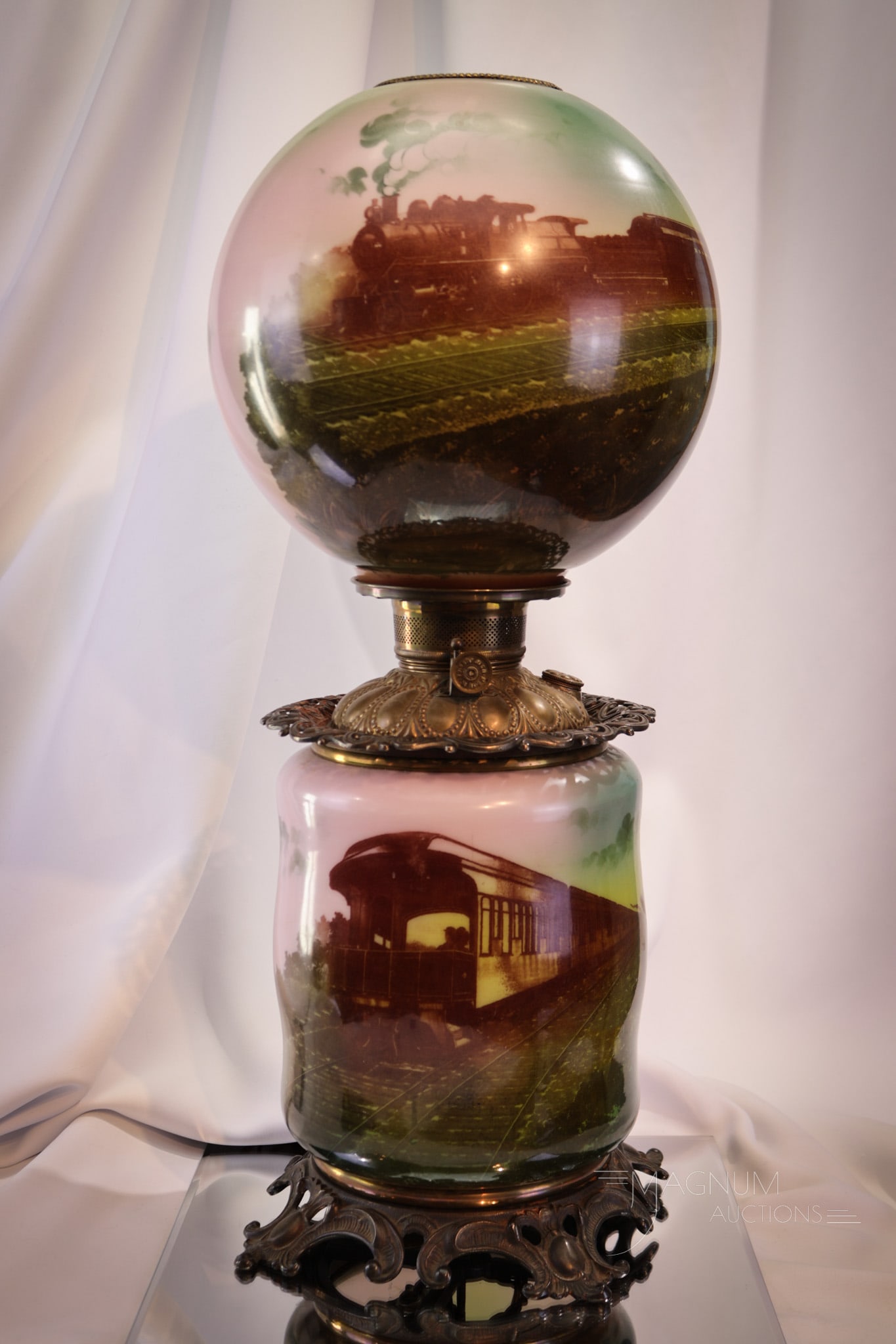 Very Rare Locomotive Victorian Gone with the Wind Lamp: An exceptional find is this Very Rare locomotive decorated Victorian gone with the wind lamp. This lamp is complete with original shade and base. Lamp has been electrified. How many have you seen? Lam