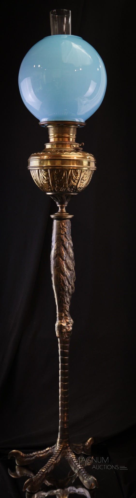 Ostrich Foot Banquet Blue Cased Glass Oil Lamp: How impressed will your guests be when they see this lamp in your home? We think very. This fine ostrich foot figural banquet oil lamp base is complete with baby blue cased glass ball shade. Lamp meas