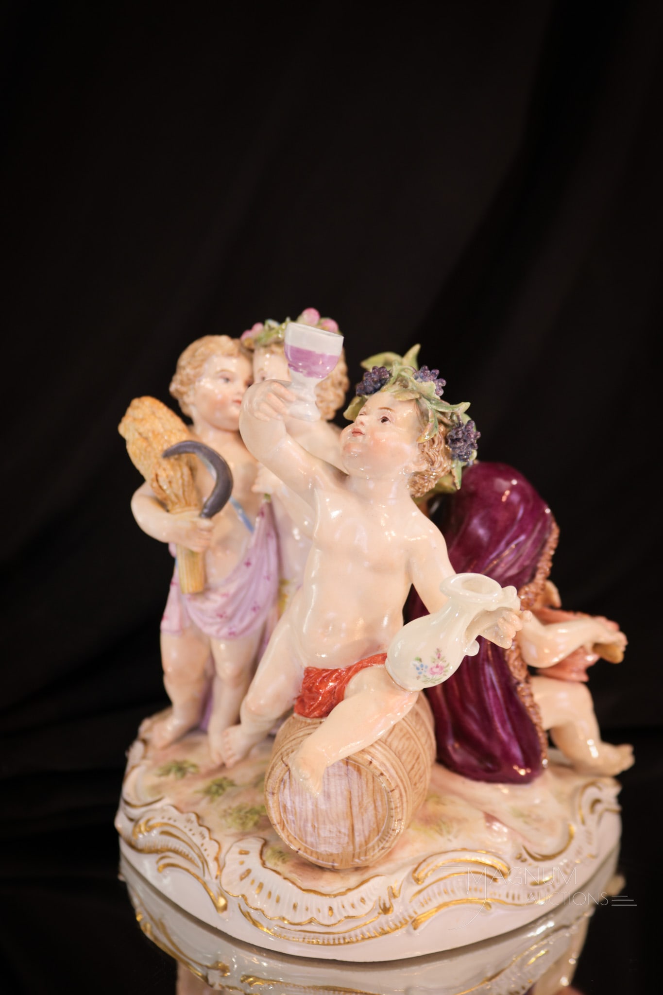 Signed Meissen Porcelain Cherubium Grouping: Delicate signed Meissen porcelain cherubium grouping engaging in merriment. Figure measures 5 1/4" tall.