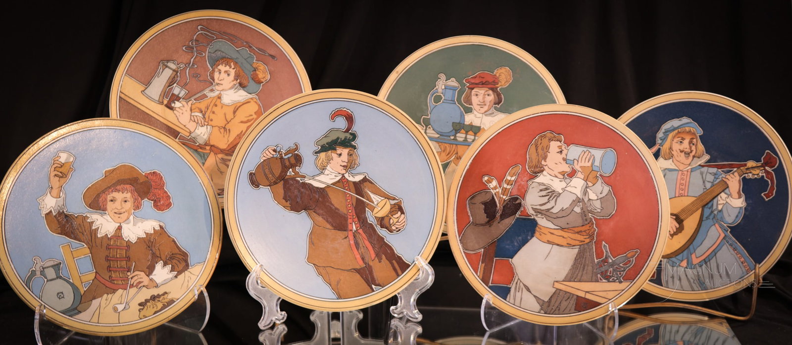 6 pc Lot German Mettlach Plates: Distinct lot of six German Mettlach plates numbered consecutively #2621,2622,2623,2624,2625, and 2626. Each measures 7 3/4" diameter.