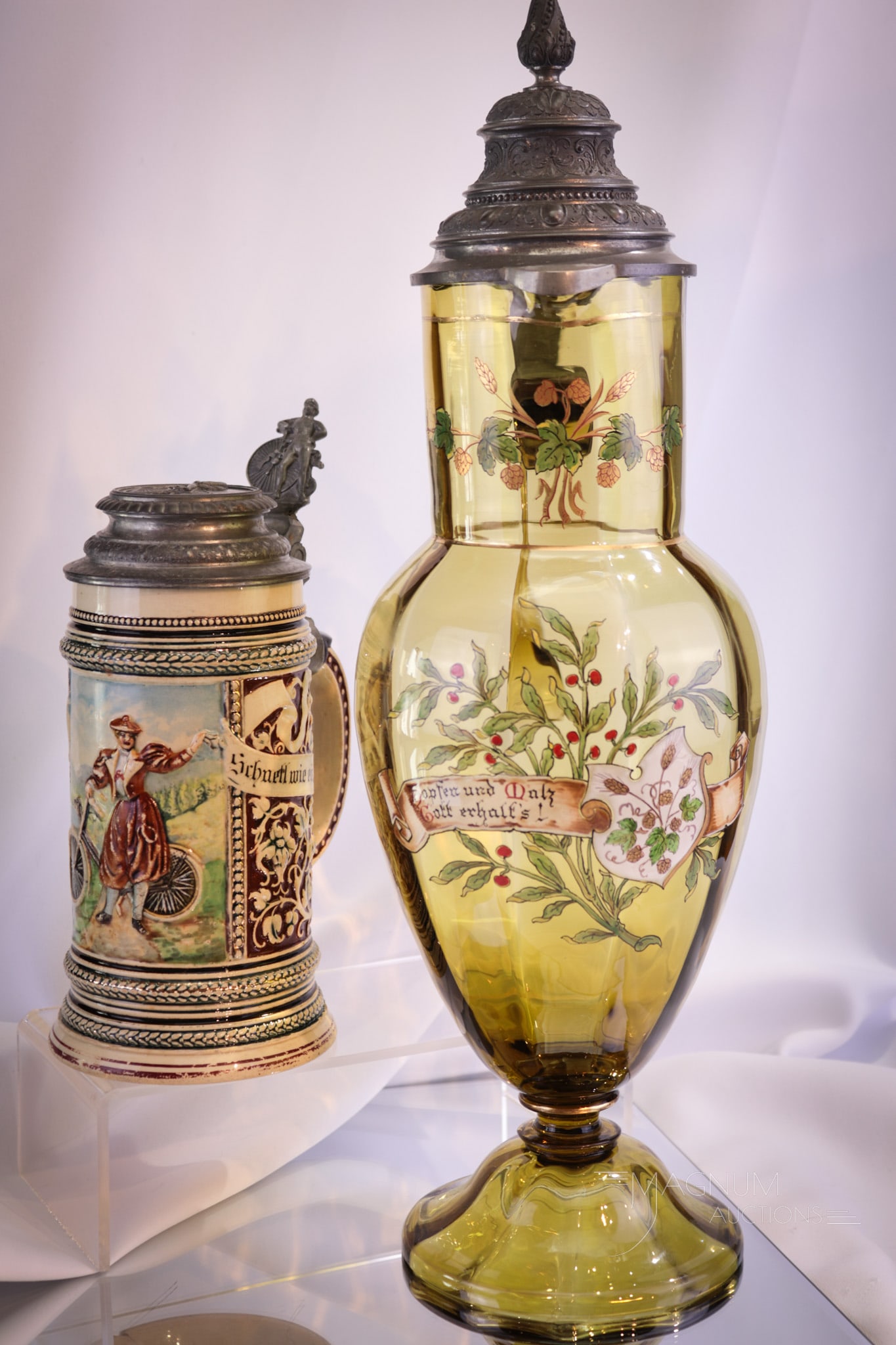 2 pc Lot Beer Stein 17" Victorian Bohemian Glass & More: Two nice finds in beer collecting. The first is a master stein in Victorian Bohemian glass in honey smoke amber. Complete with original metal mountings. The second is a German beer stein featuring cyc
