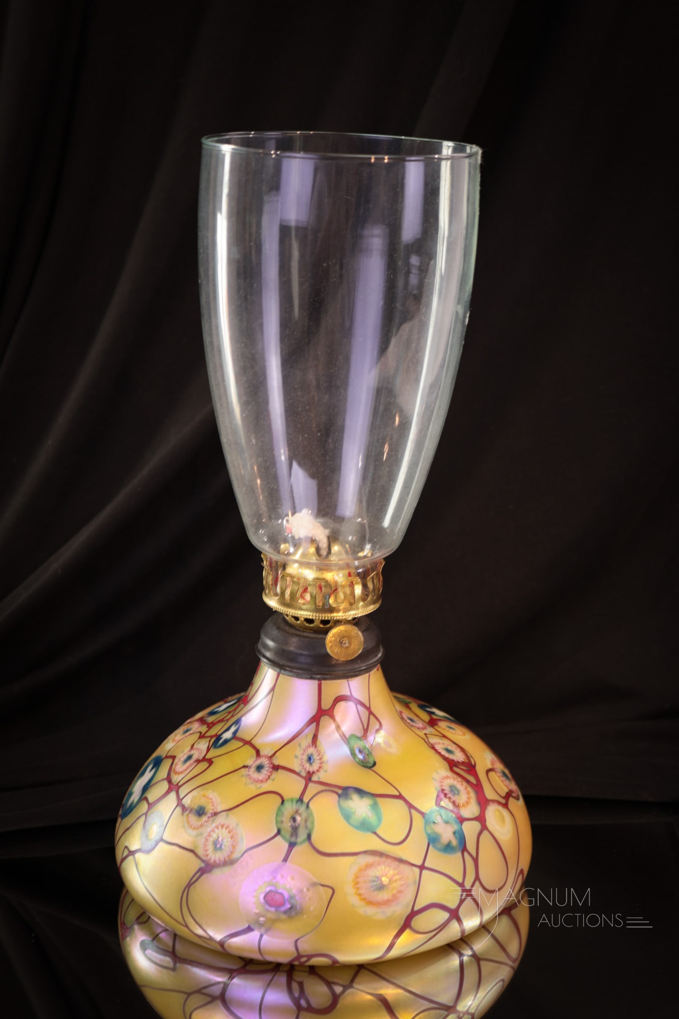 Phoenix Studios Carl Radke Millefiori Iridescent Glass Oil Lamp: Charming Phoenix Studios and Carl Radke iridescent millefiori oil lamp. This piece is circa 2005. Lovely color and design. Lamp measures 4" tall to the burner collar.
