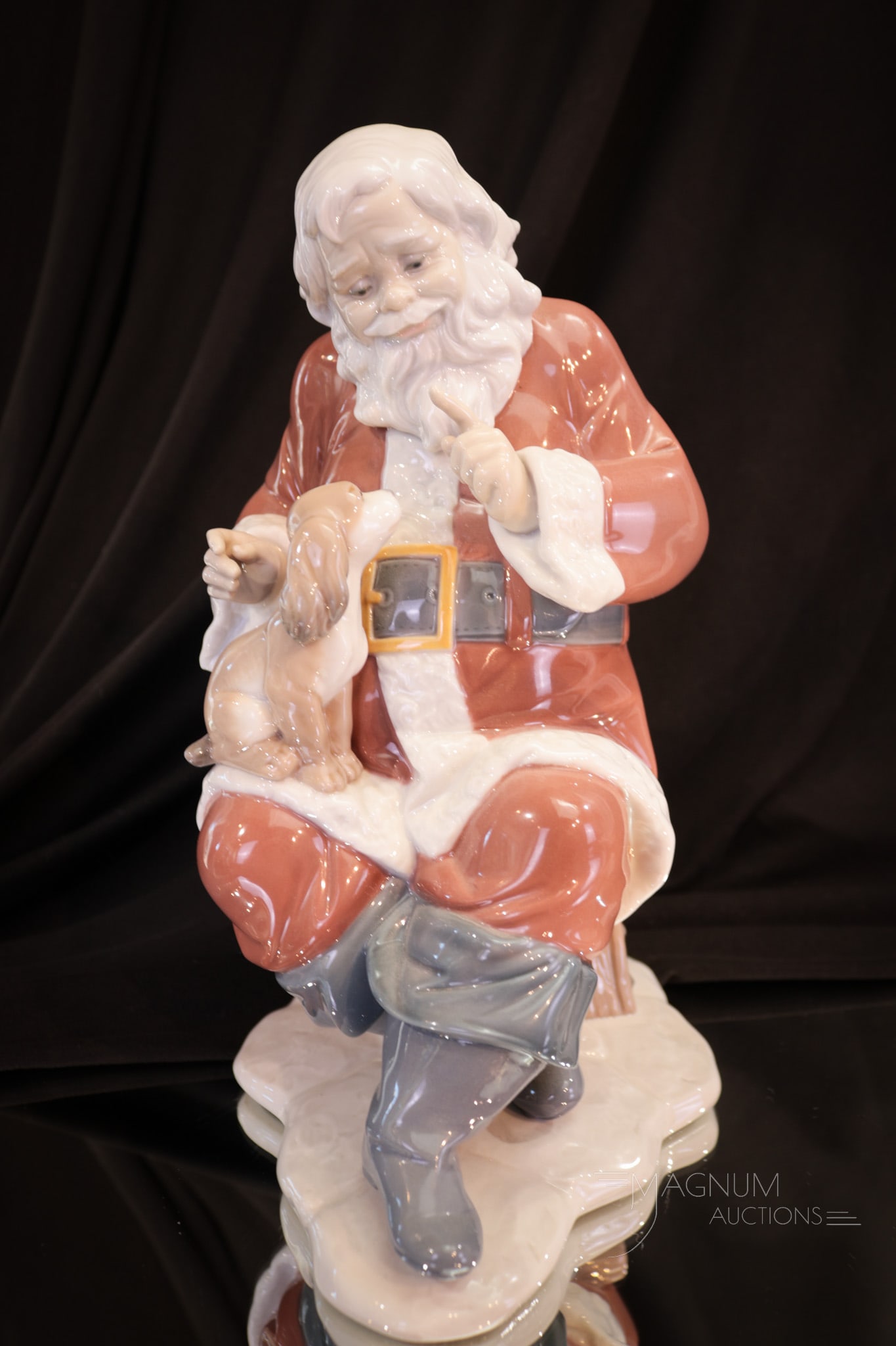 Large 9" Lladro Santa Figurine: Charming Santa Lladro figurine titled, "Santa's Little Secret and numbered 6890." Santa measures a delightful 9" tall.