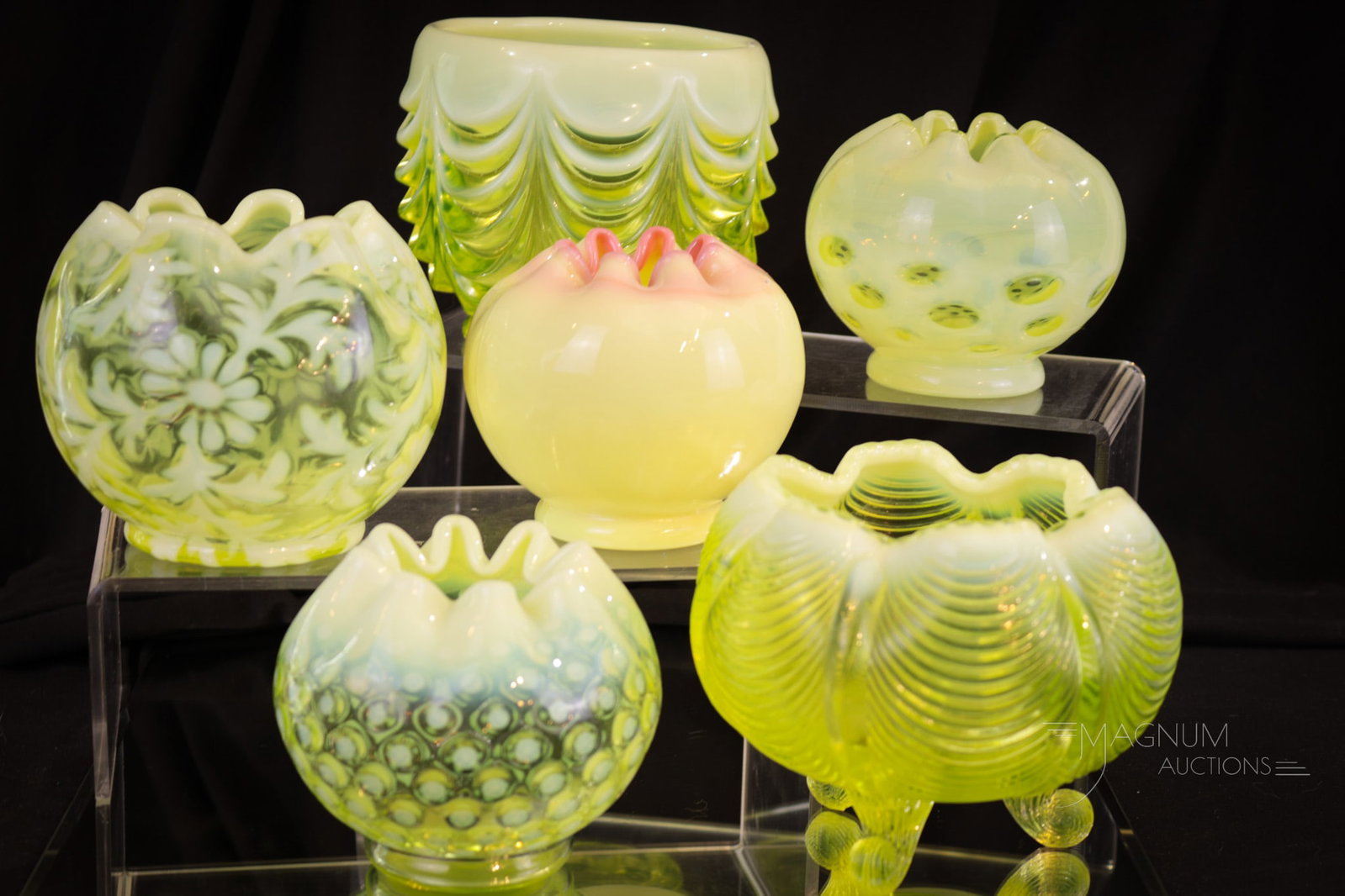 6 pc Lot Fenton Art Glass Vaseline Rose Bowls: Six delights in Fenton art glass rose bowls sure to be collection enhancing. This lot includes a vaseline opal coin dot, a drapery, a Frisco pattern, Daisy and Fern, Polka Dot, and finally a glossy bu