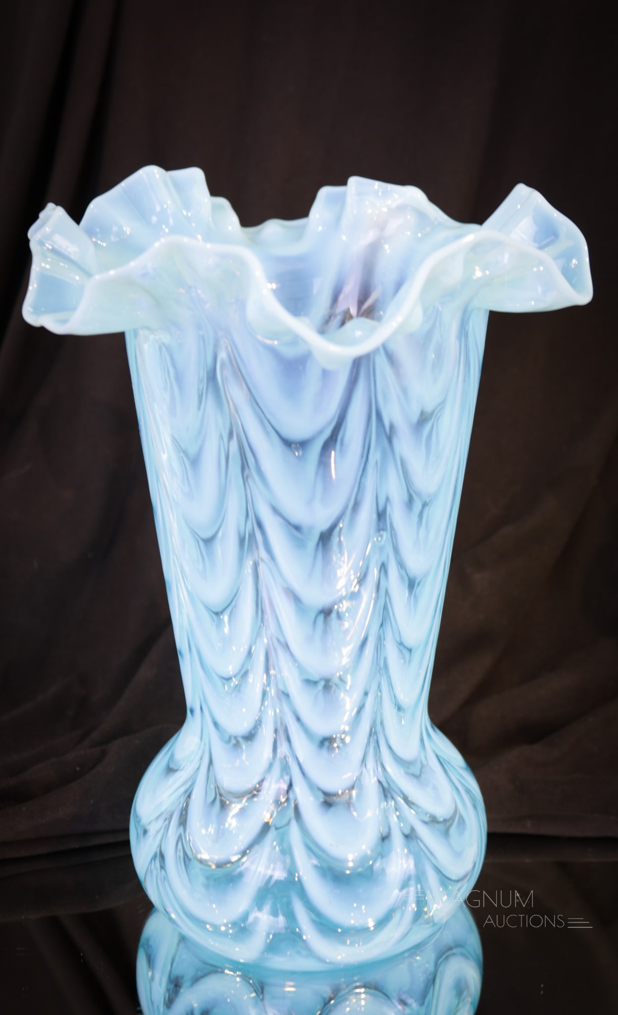 Fenton Blue Drapery Art Glass Ruffled Vase: Lovely Fenton art glass blue opalescent Drapery pattern ruffled vase. Vase measures 9 1/2" tall. Excellent color and opal.