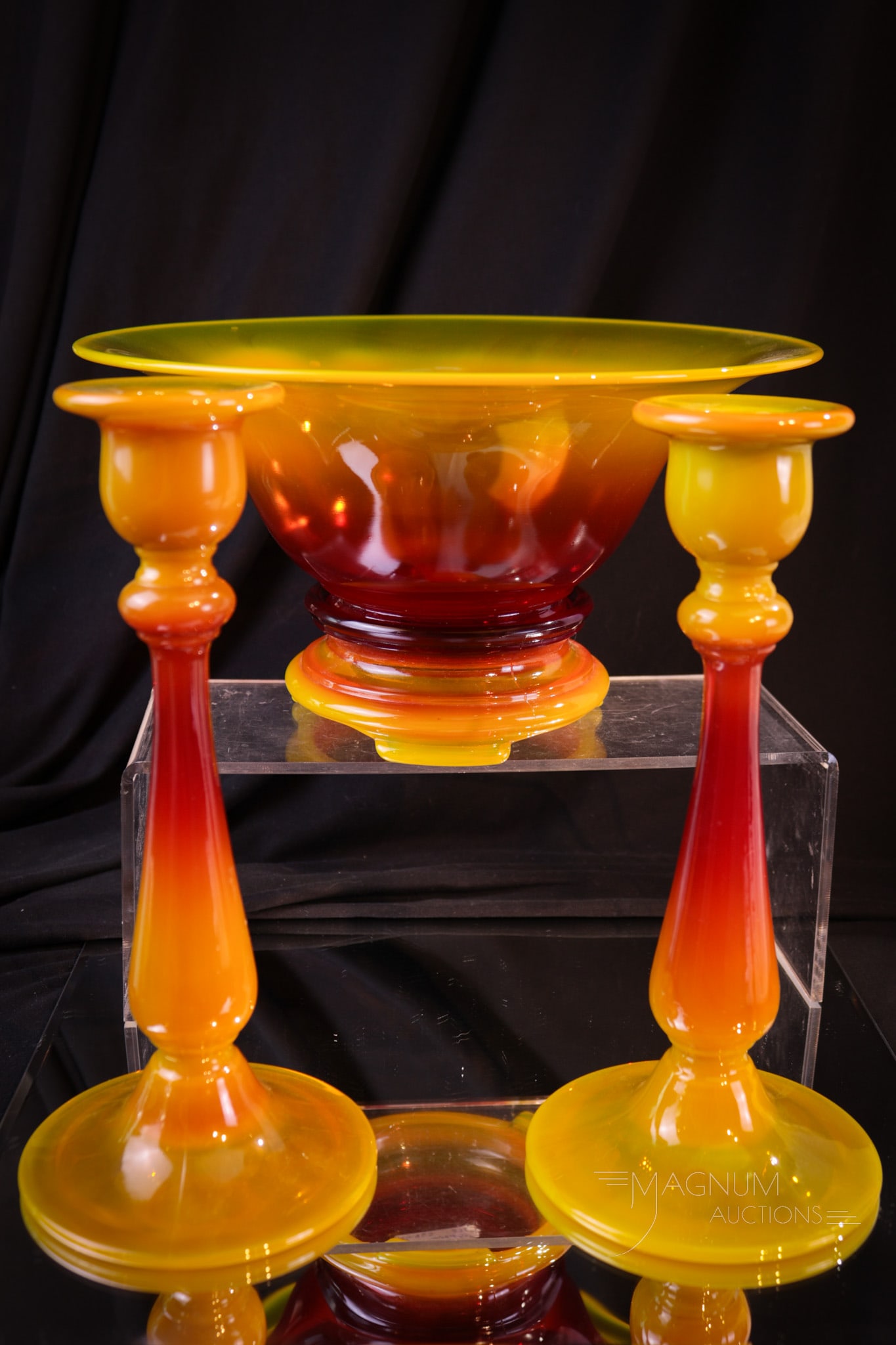 4 pc Lot Co-operative Flint Glass Sunset Console Set: Super four piece lot of Co-operative Flint Glass in Sunset color. This console set is complete with a pair of candlesticks console bowl with base. Tallest measures 9".