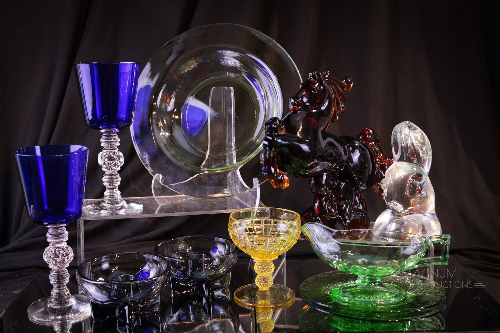 11 pc Lot Heisey Glass: Eleven selections sure to bring a tear to your eye. Something for everyone in this lot of plenty. A vaseline glass bowl, two cobalt Spanish stems. Dawn Lodestar candles, a crystal dog head, three piec
