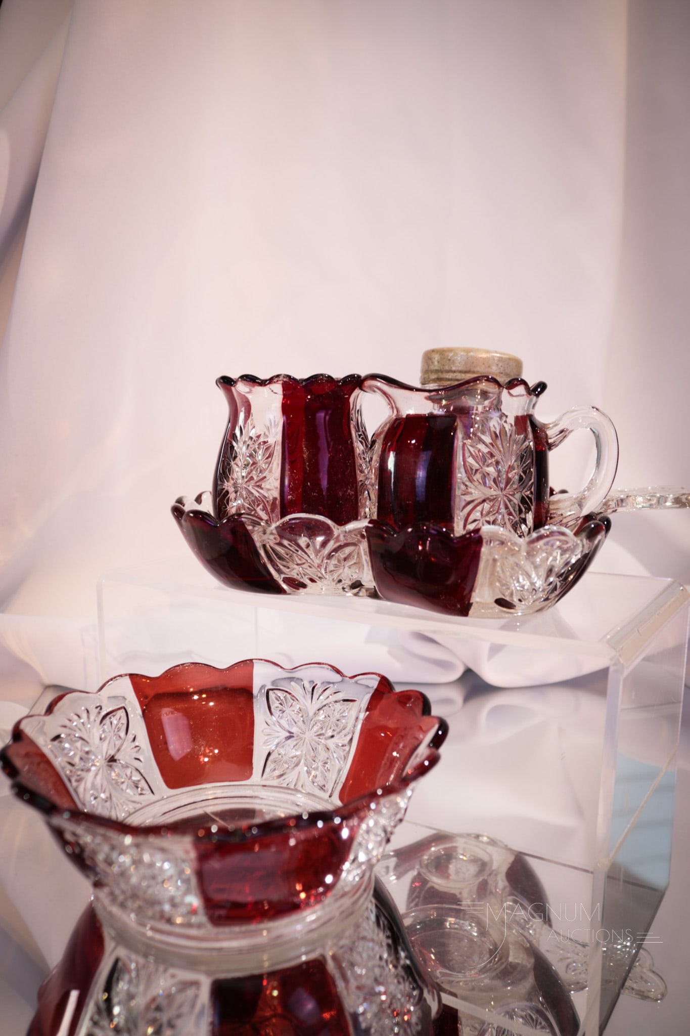 5 pc Lot Riverside Brilliant Ruby Stained Glass: Five unique selections in Riverside ruby stained glass in the Brilliant pattern. This lot includes a berry bowl, individual creamer, toothpick holder, salt shaker, and a tray. Tallest measures 3 1/2".