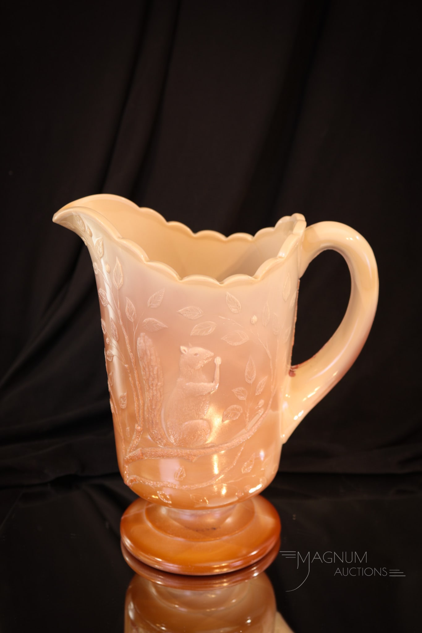 Greentown Chocolate Glass Squirrel Victorian Water Pitcher: Great color and definition to this Greentown Victorian chocolate glass water pitcher. This fine example is a welcome addition to any collection. Do you have one? Pitcher measures 8 3/4" tall.