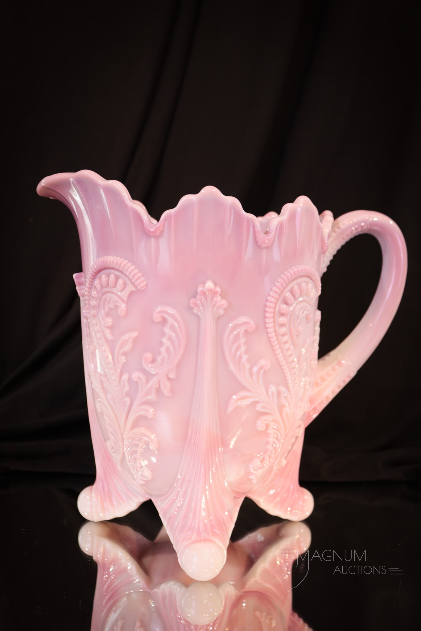 Northwood Pink Slag Victorian Glass Water Pitcher: Pretty in pink Victorian glass water pitcher in the Inverted Fan and Feather patter. This is a fine example with great color and definition. Pitcher measures 8" tall. Provenance: This item is from the
