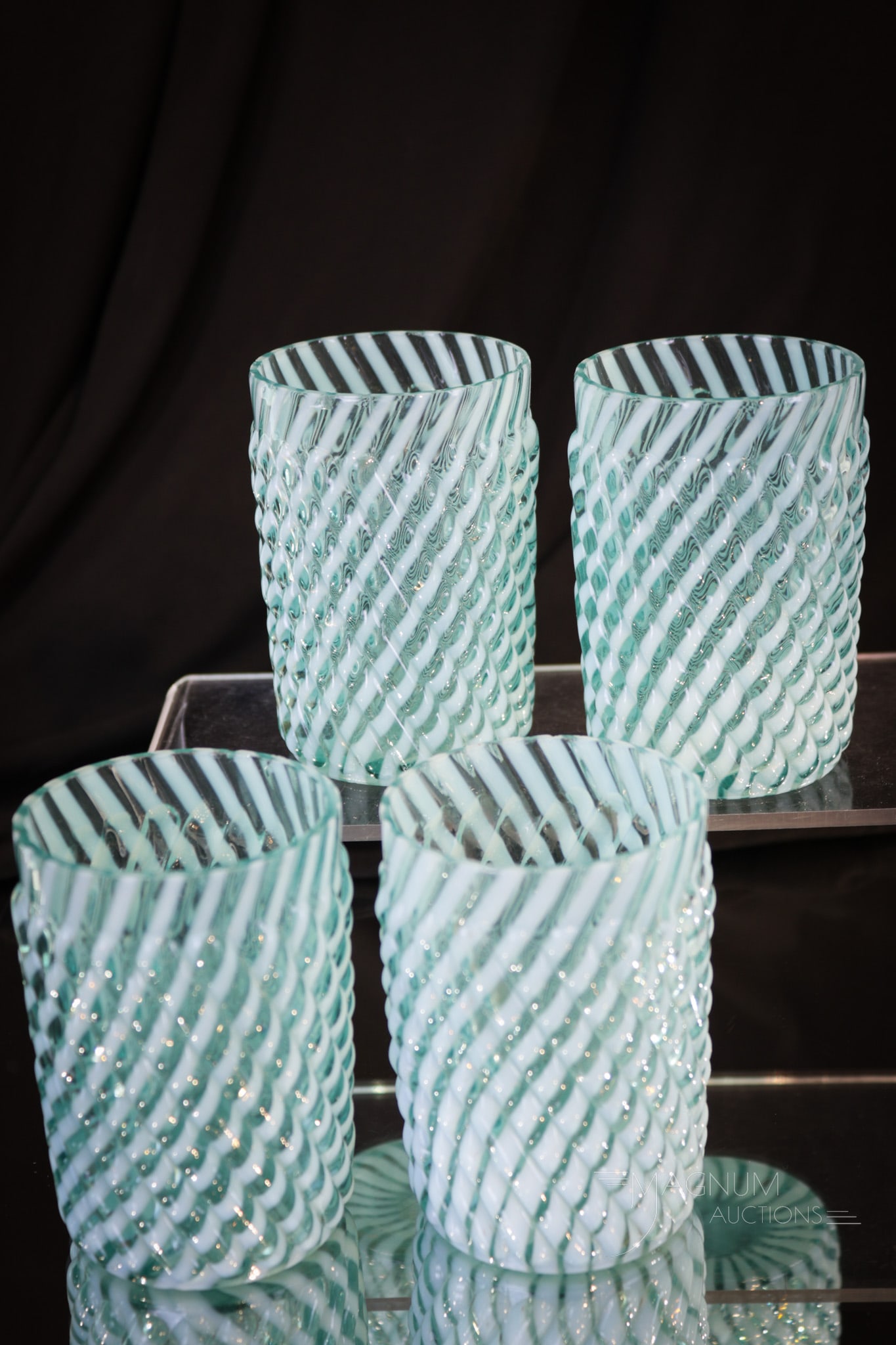 4 pc Lot Blue Opalescent Reverse Swirl Victorian Tumblers: When one tumbler is just not enough to complete your set, how about four? We have four fine examples of the Reverse Swirl pattern. Each with great color and opalescence. Each measures 3 3/4" tall.