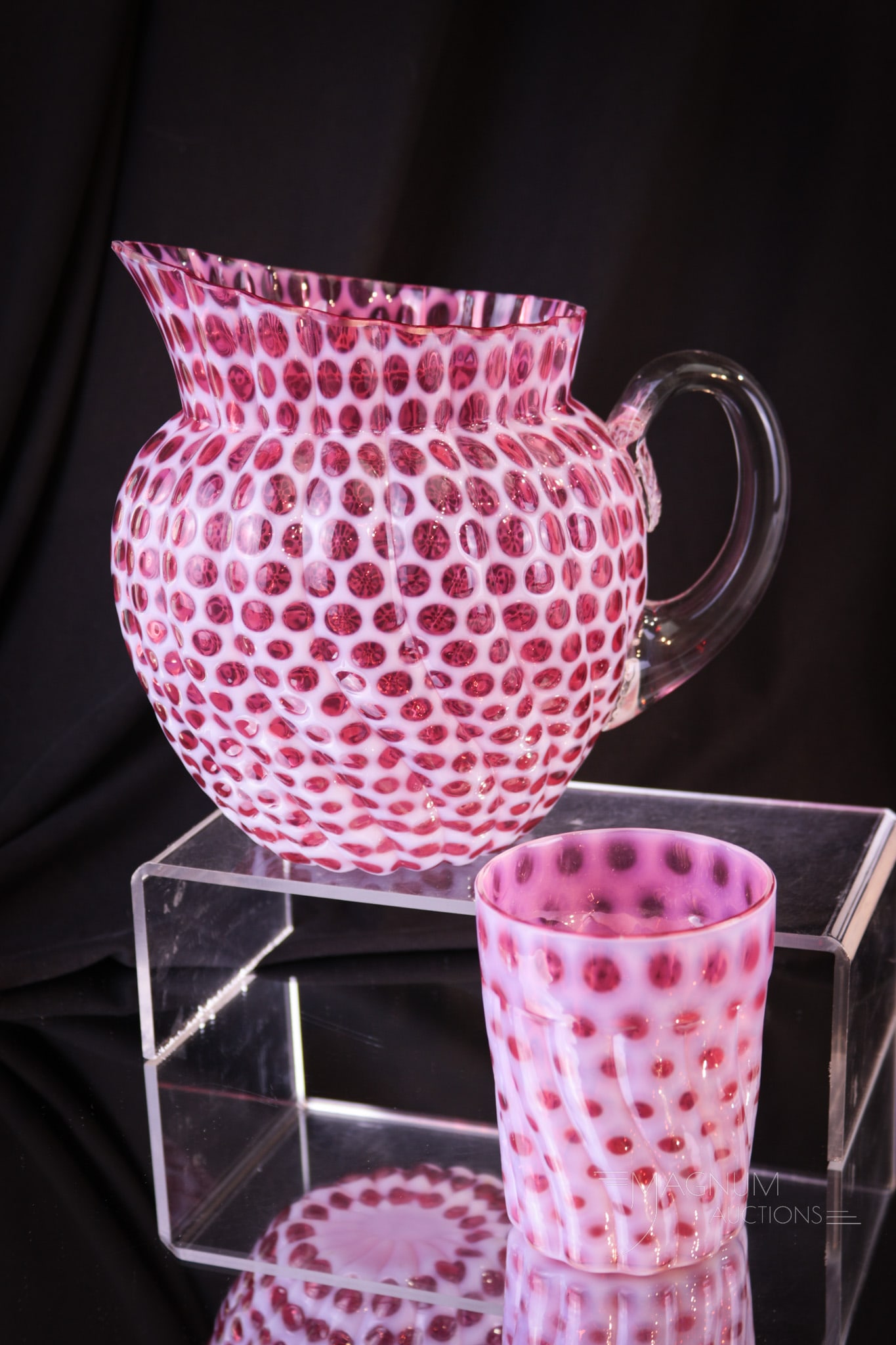 Hobb's Cranberry Opalescent Windows Swirled Victorian Water Pitcher & Tumbler: A scarce find in Hobb's Glass. This pitcher in the Hobb's Windows Swirled pattern measures 7" tall the cut rim. This pitcher has a matching tumbler to go with it. Pitcher with as-made inner rim chips 