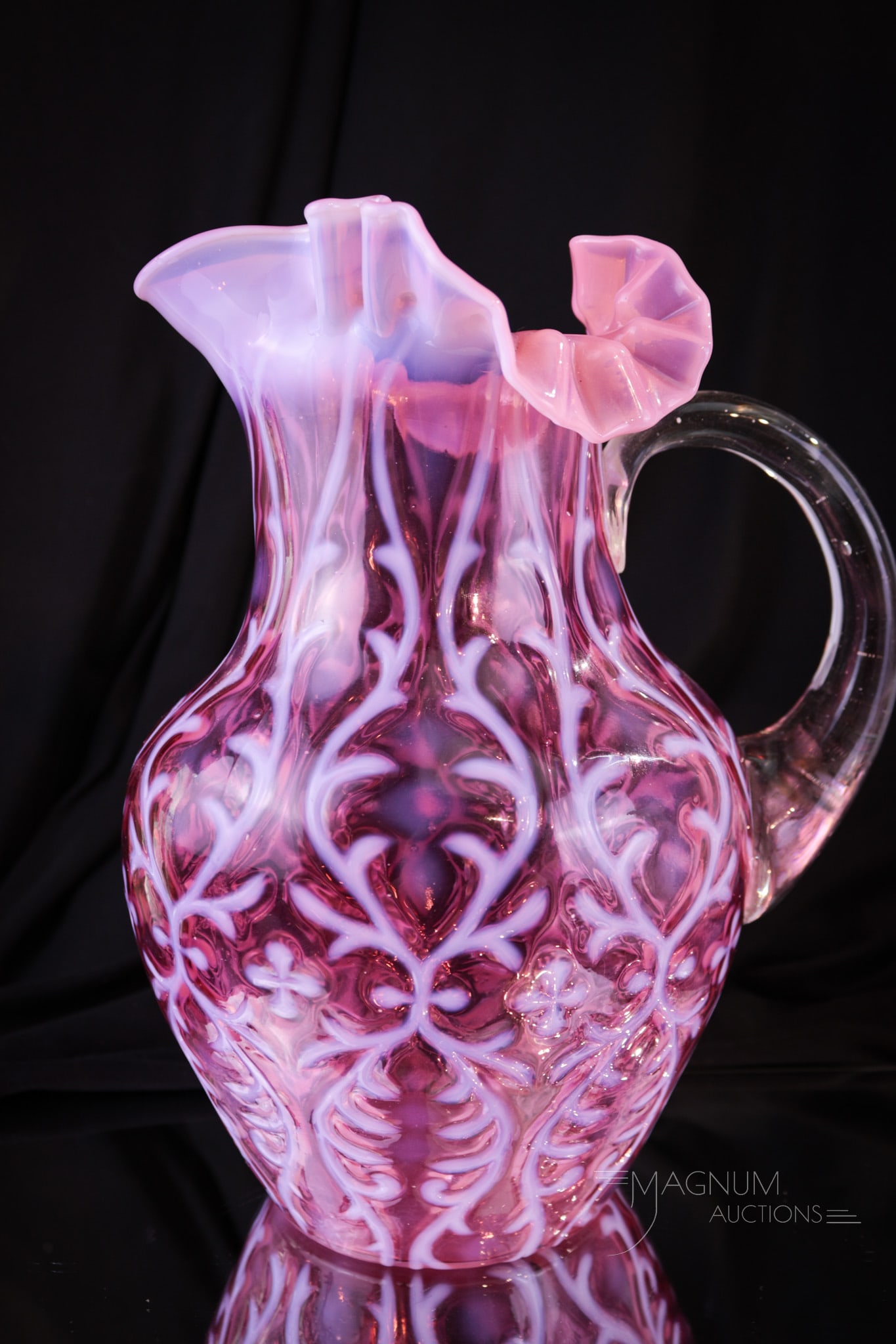 Northwood Cranberry Opalescent Victorian Glass Spanish Lace Pitcher: Strikingly beautiful Northwood cranberry opalescent Spanish Lace pattern pitcher in the shoulder mold. This one with nice deep cranberry coloring and crisp white opalescence. Pitcher measures 9 3/4" t