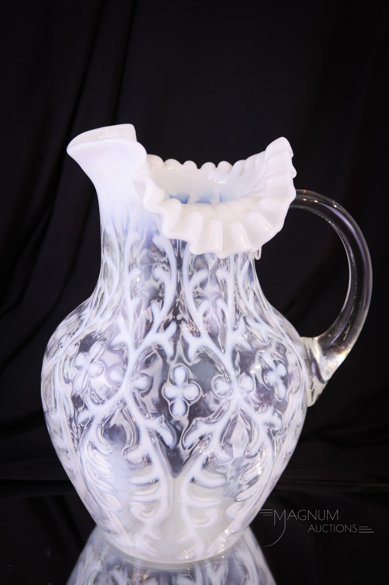 Northwood Spanish Lace Victorian Glass Water Pitcher: Crisp brilliant white opal makes up this fine Northwood Spanish Lace Victorian water pitcher. This pitcher in the classic shoulder mold has excellent clarity and form. Pitcher measures 9 3/4" tall. Pr